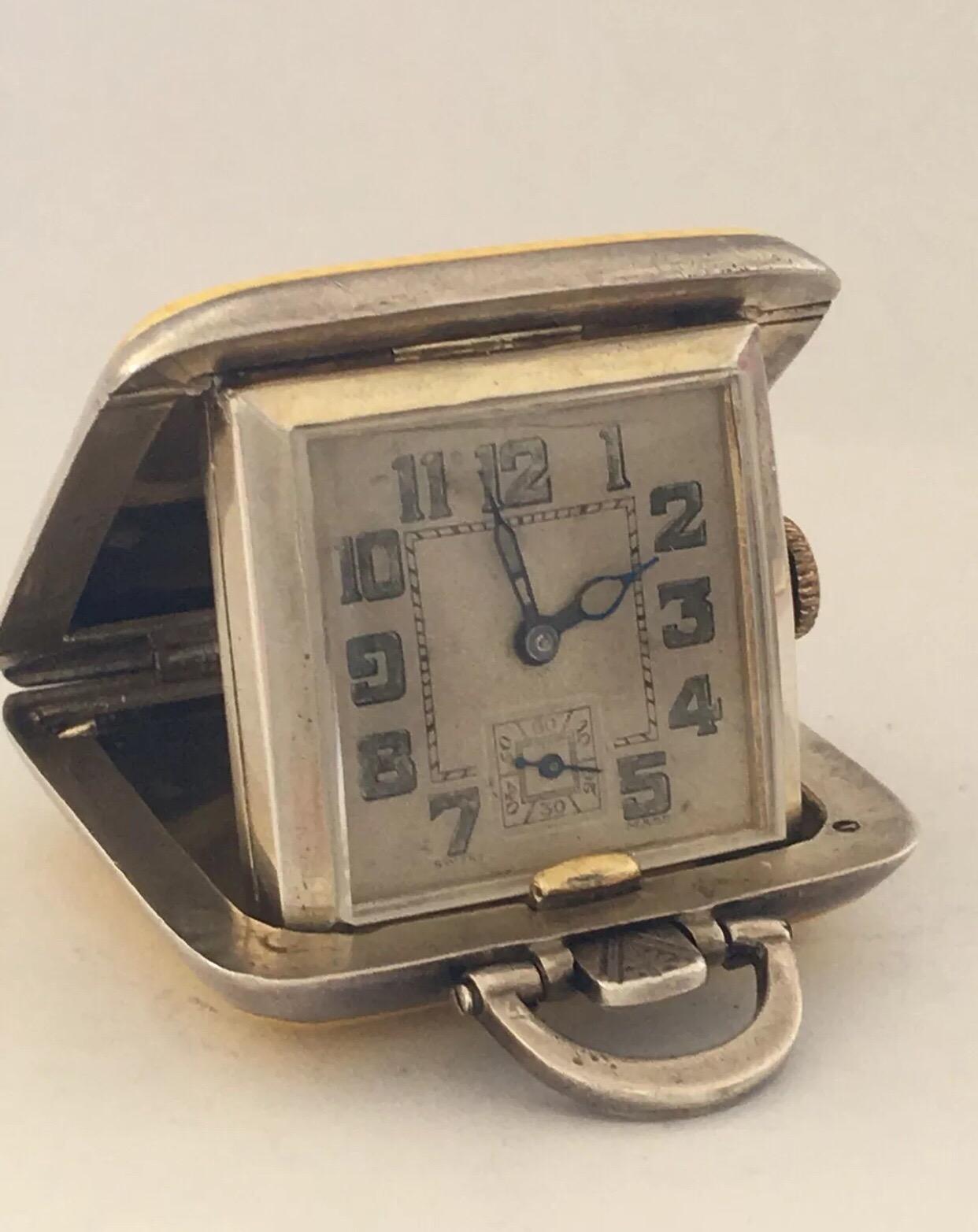Small Silver yellow Enamel Travel Clock.


This clock is working and ticking well. Visible chipped on the side of the enamel case as shown on the photos.