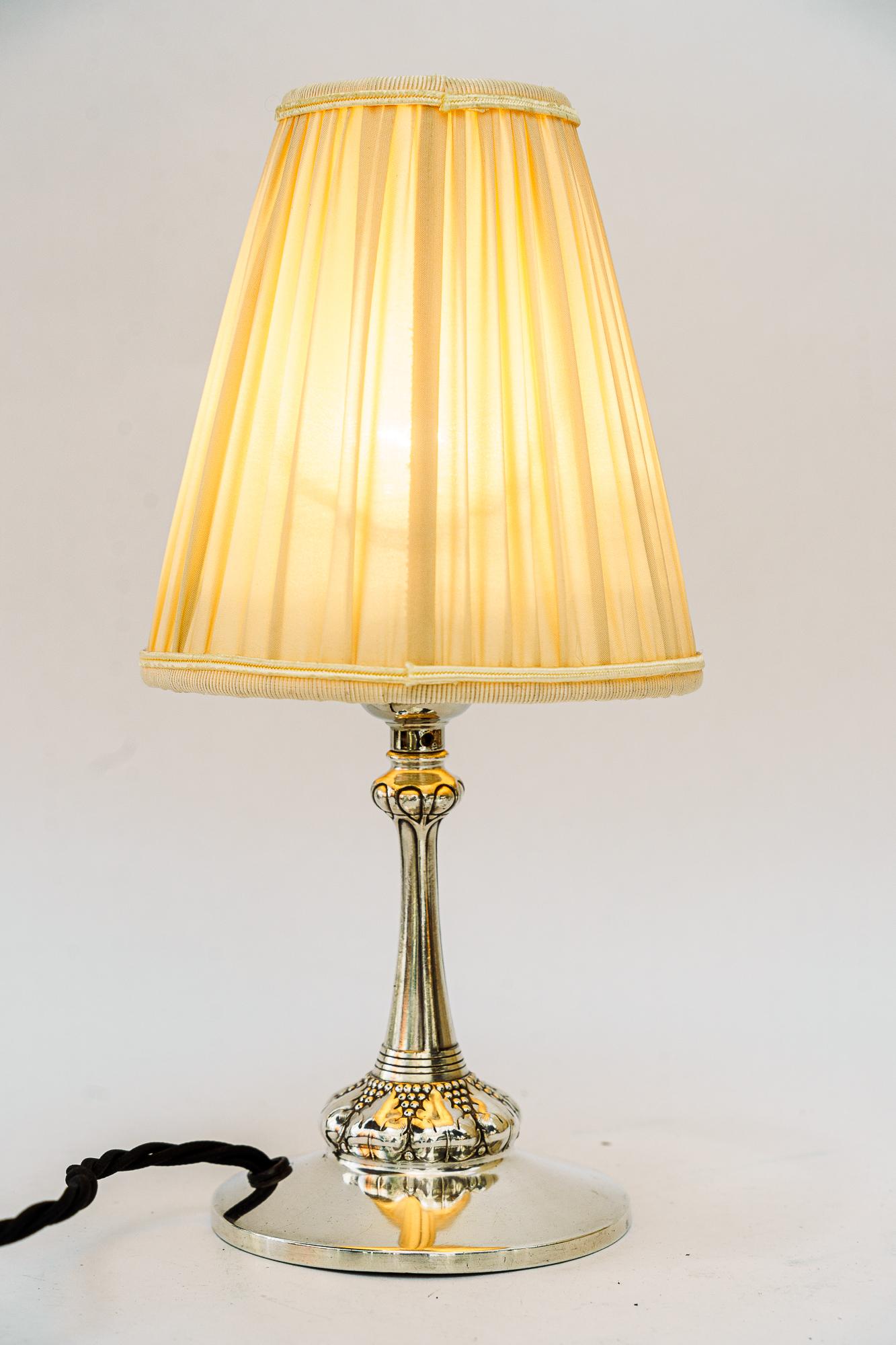 Early 20th Century Small silvered art deco table lamp with fabric shade vienna around 1920s For Sale