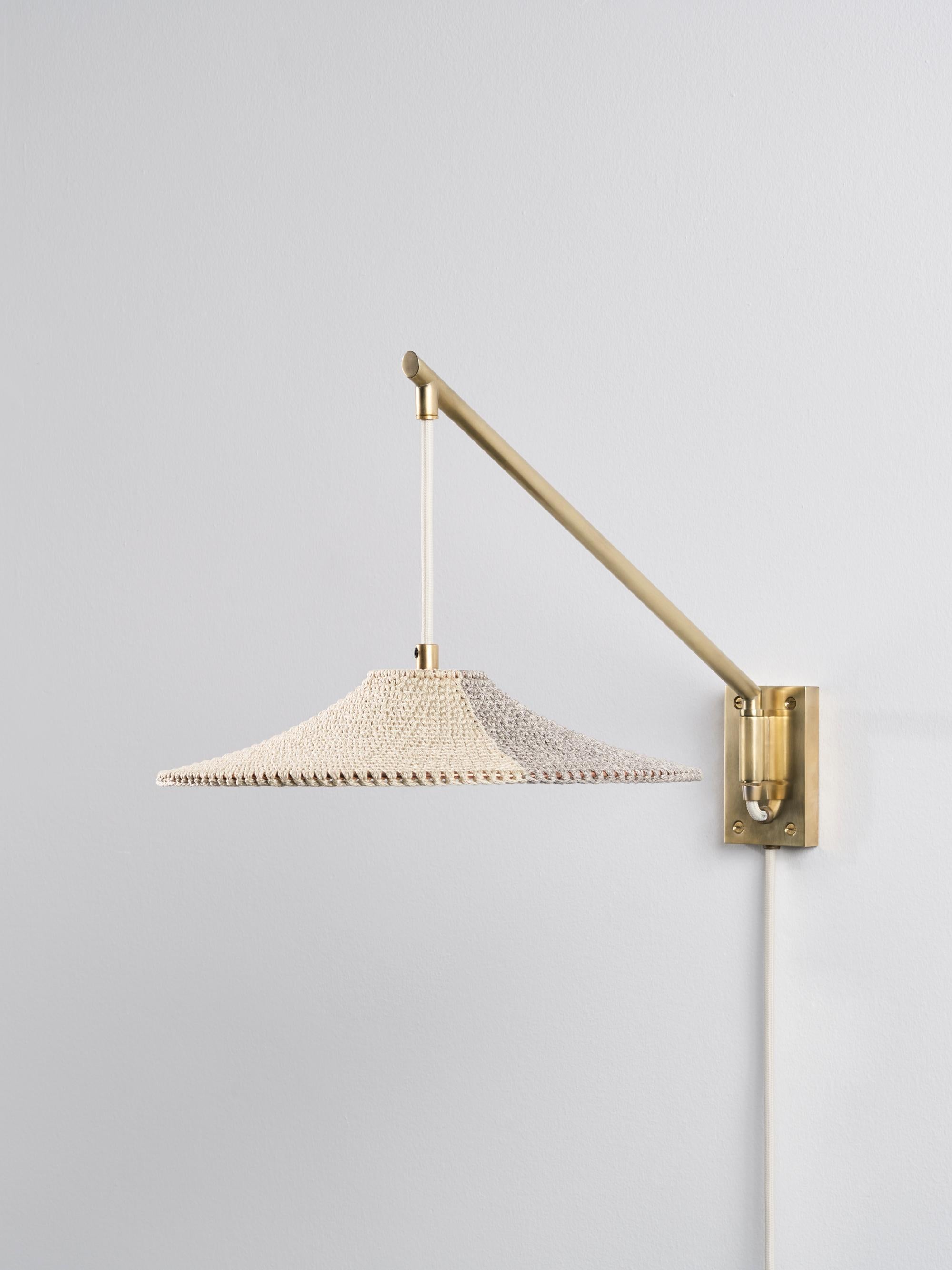 Small simple shade 01 50/50 wall lamp by Naomi Paul
Dimensions: D 30 x W 50 x H 27 cm
Materials: Metal frame, Egyptian cotton cord.
Colors: Ecru and Down grey.
Available in other colors and in 2 sizes: D 30 x W 50, D50 x W 102 cm.
Available in