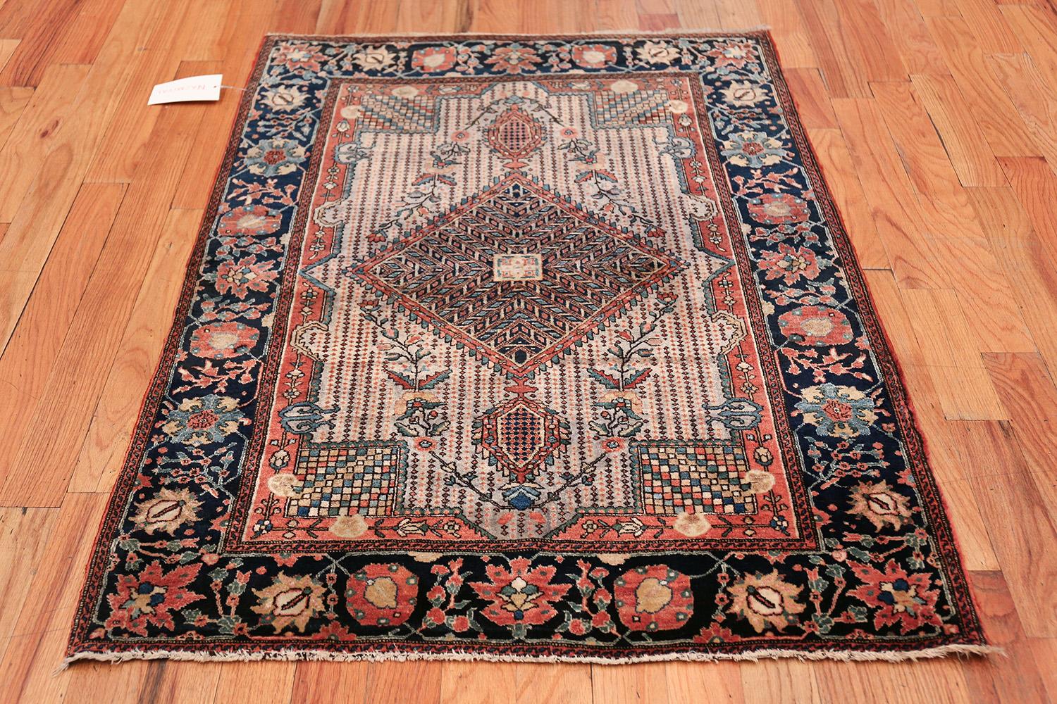 Magnificent Small Size Antique Persian Farahan Sarouk Rug, Country of Origin / Rug Type: Persian Rug, Circa Date: 1900 – Tones of earth and water bring a garden to life in this breathtakingly complex antique Persian Sarouk Farahan rug. The central
