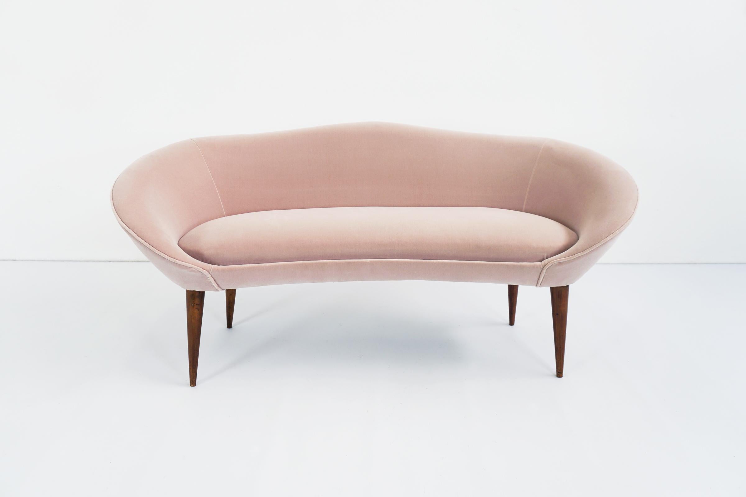Beautiful small sofa bench totally reupholstered in pale powder rose velvet.