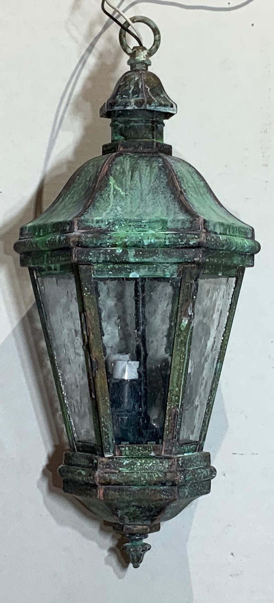 Elegant small Lantern quality made of solid brass with seeded Glass Six sides, canopy and chain included ,very nice oxidize patina , with three 40/watt light .
