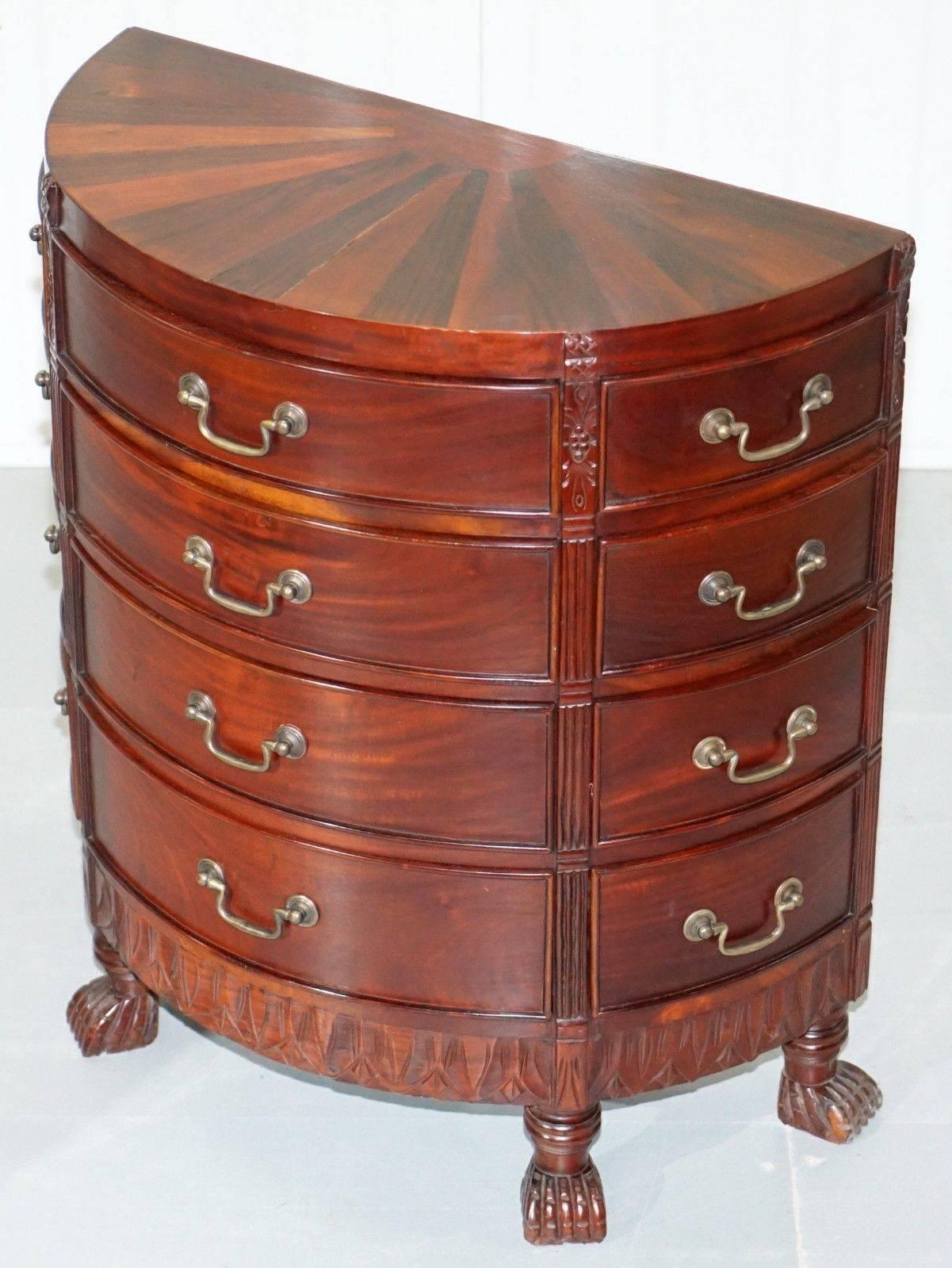 We are delighted to offer for sale this stunning solid mahogany demi line bow fronted size table sized chest of drawers

A very good looking and well-made piece, the top has different colour cuts of mahogany which give it a sunburst finish,