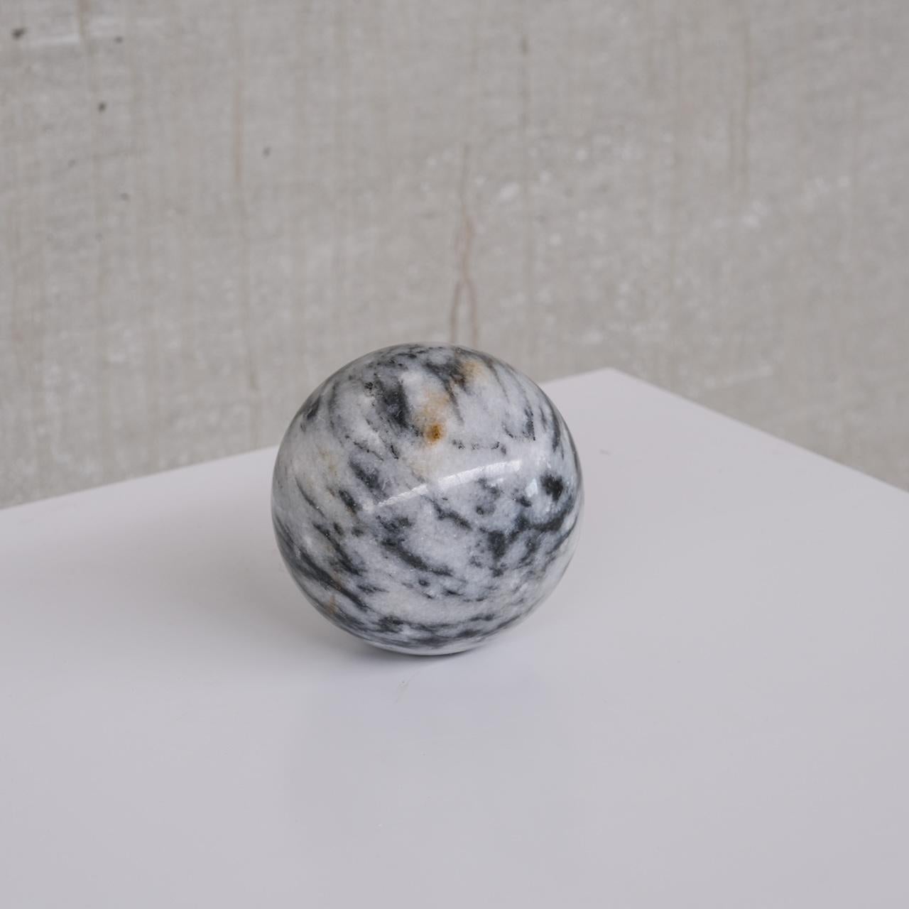 A small solid marble ball.

Italy, c1970s.

Ideal desk or shelf geometric curio.

Tactile objet.

Vintage condition, occasional scuff commensurate with age.

Location: Belgium Gallery.

Dimensions: 11 Diameter in cm.

Delivery:
