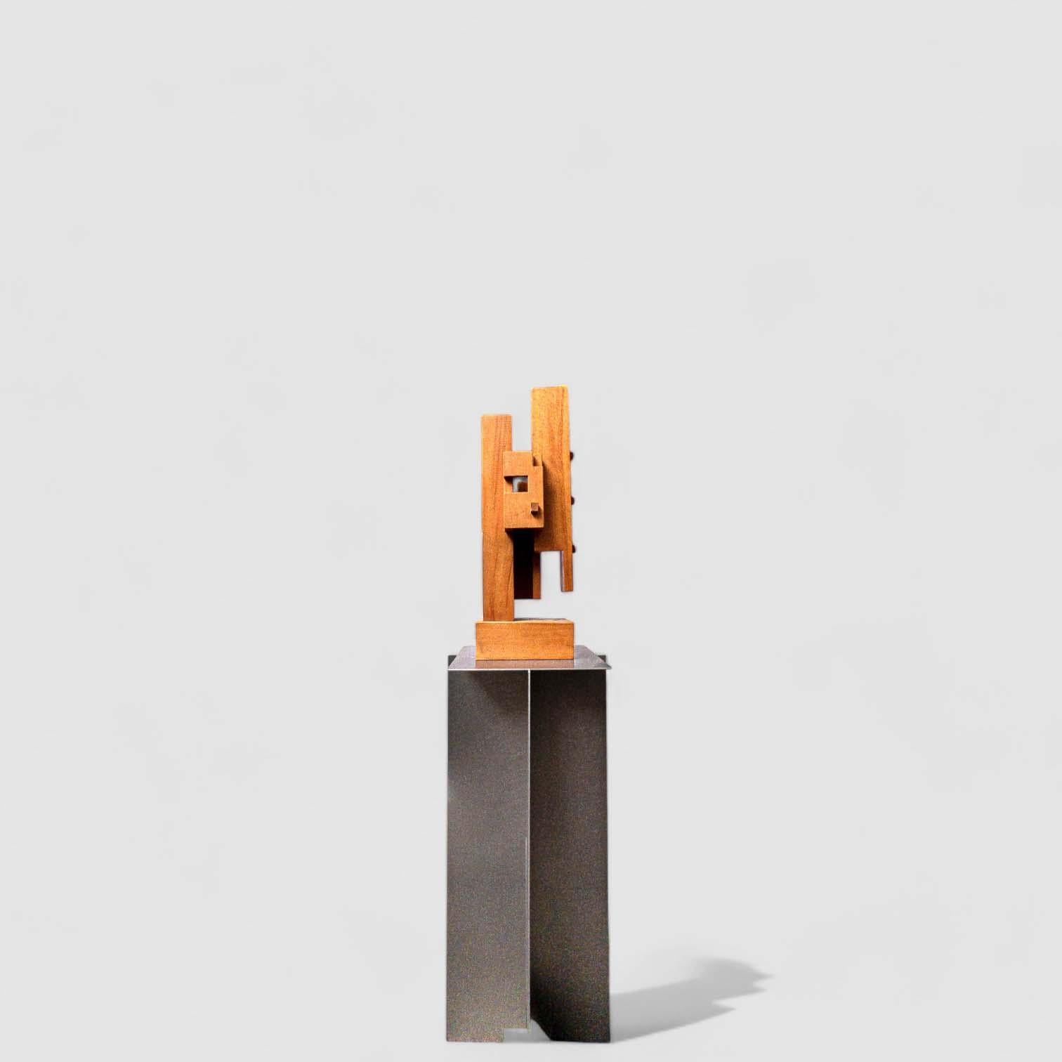 This solid wood sculpture, commissioned by the city of The Hague, evokes architecture with its stacked geometric blocks reminiscent of a model for an apartment building. Created in the 1980s, the work reflects the influence of Constructivism and De