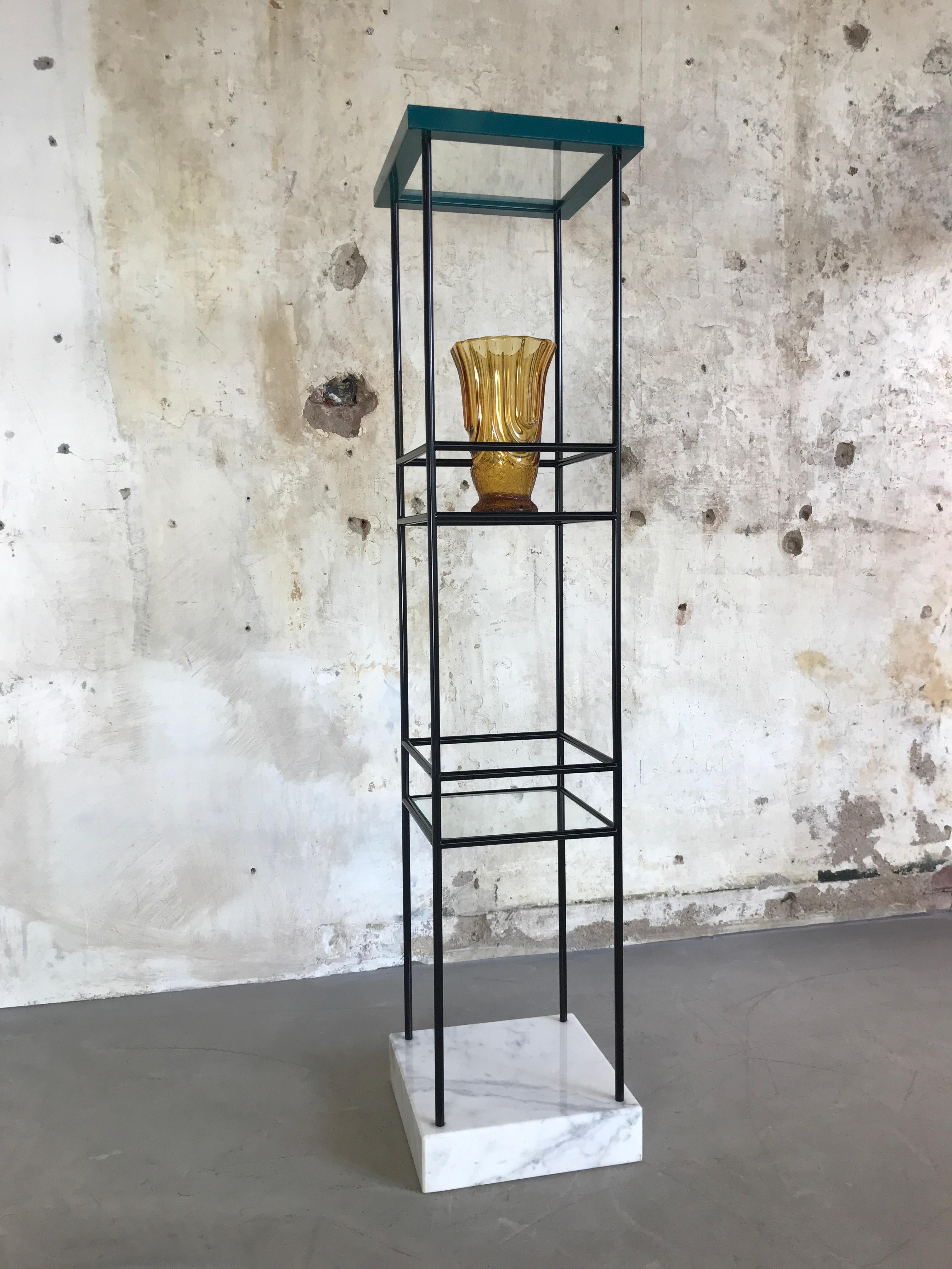 An impressive and rare column of square, black steel and three cut glass shelves on a heavy white Carrara marble base. The top is a wooden frame lacquered in petrol blue.
Total weight over 28 kg! (almost 62 lb.).
 
