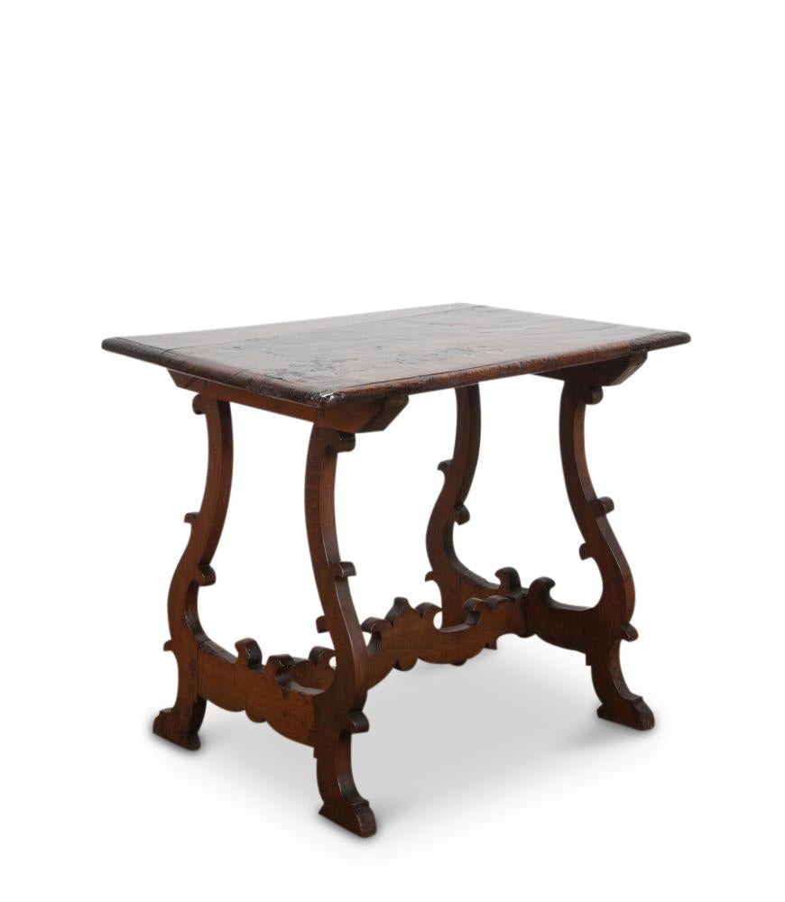 A wonderful and useful Spanish 18th Century walnut table.

In smaller proportions which will work well as a side table in most interiors. 

There has been a historical repair to the top which only adds to the charm of this piece.
