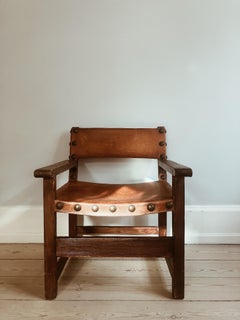 Small Spanish brutalist leather chair