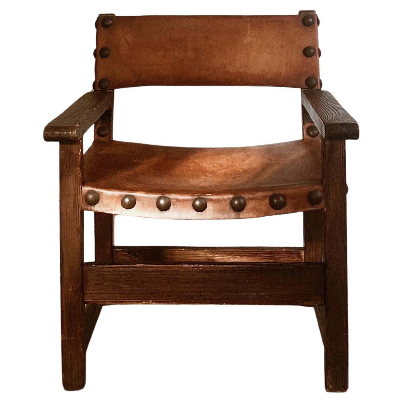 Small Spanish brutalist leather chair