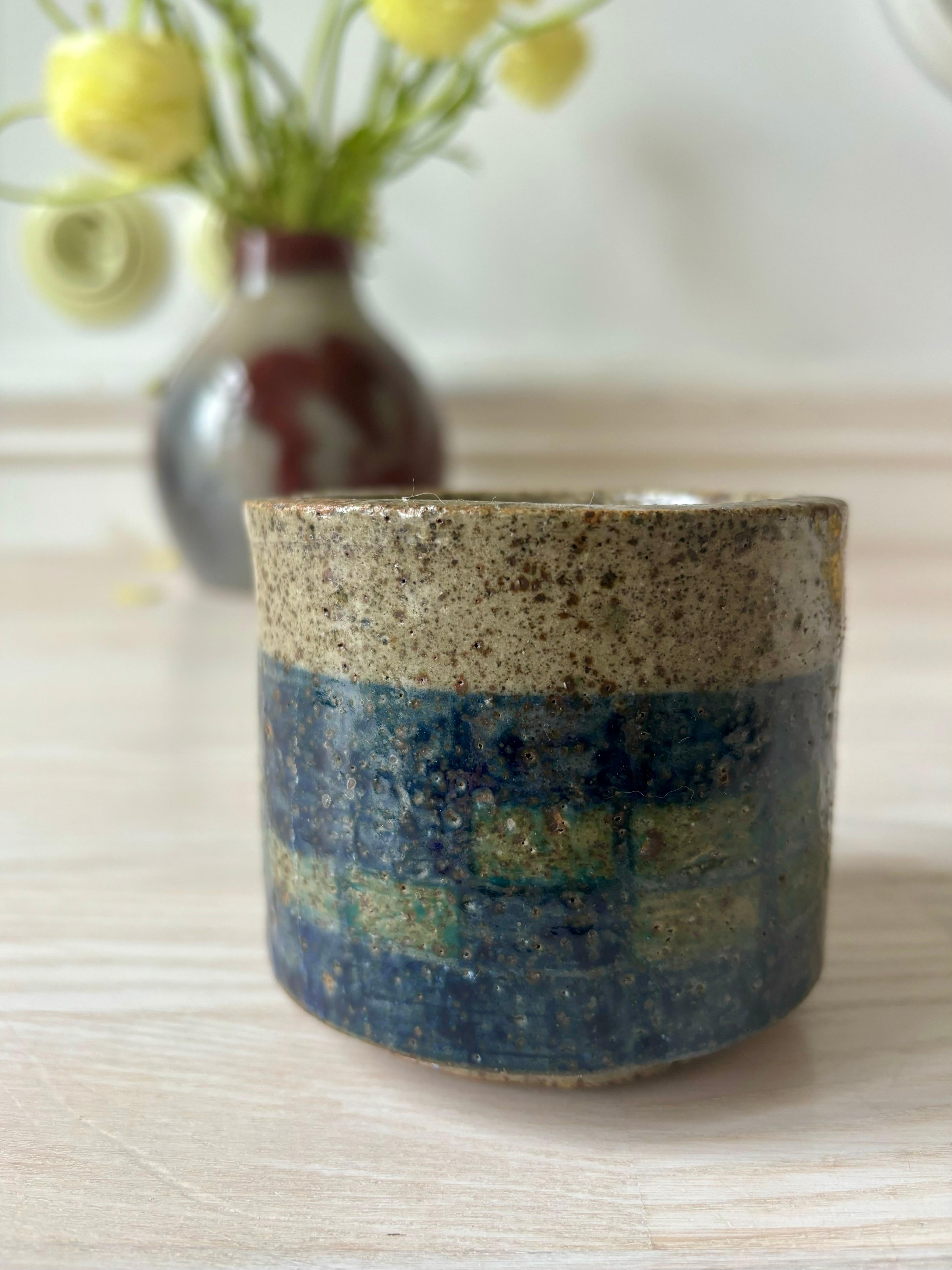 Handmade Spanish modern round planter vase with speckled glaze and blue, green squares with crackles. Thick ceramic walls on small foot. Signature and original label under base. Beautiful vintage condition. 
Spain, circa 1970s