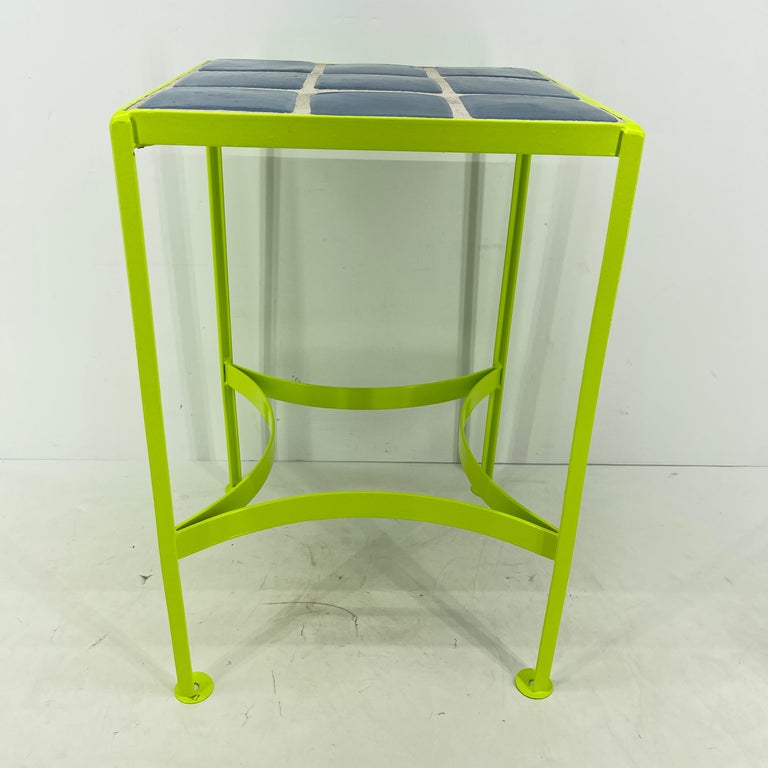 Mid-Century Modern square tile top side table. The iron legs and frame have been freshly powder coated in bold and bright chartreuse. The melding of the blue tile and the chartreuse are fabulous! This sweet little table is perfect indoor or outdoor.