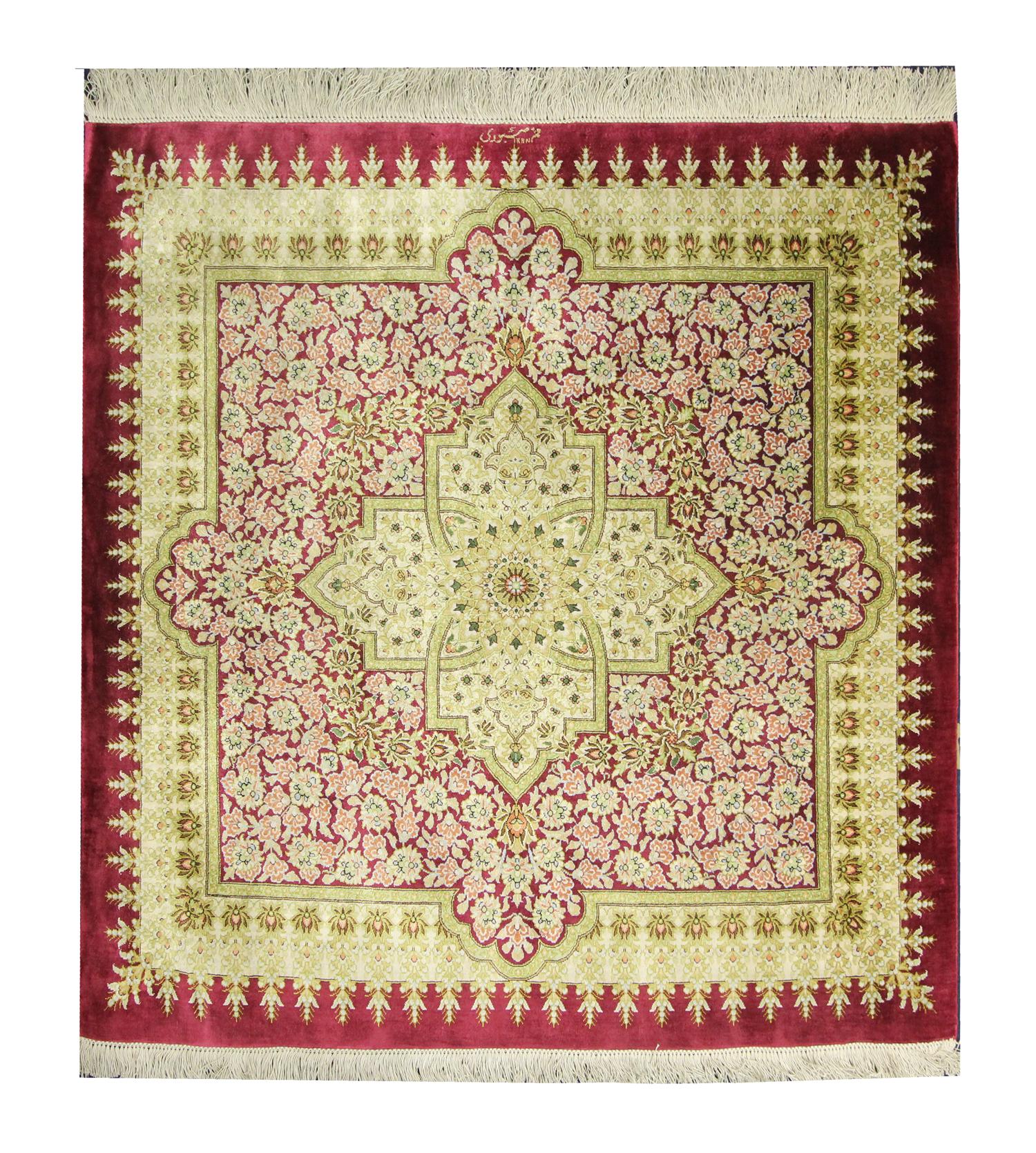 This luxurious square rug was woven by hand in Azerbaijan and features a large medallion design. Featuring highly-decorative floral pattern, an elegant medallion design and layered repeat border with beige, pink and cream accents on a rich red