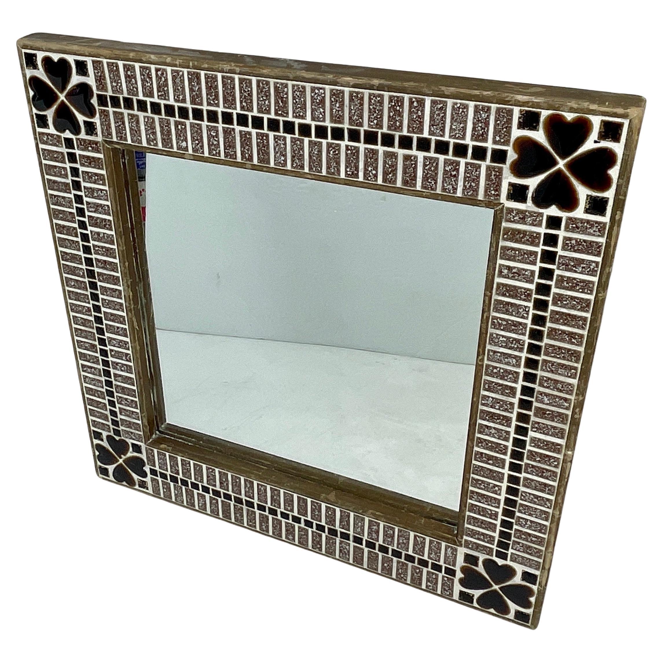 Square Mid-Century Modern tile mirror with heart decorations.