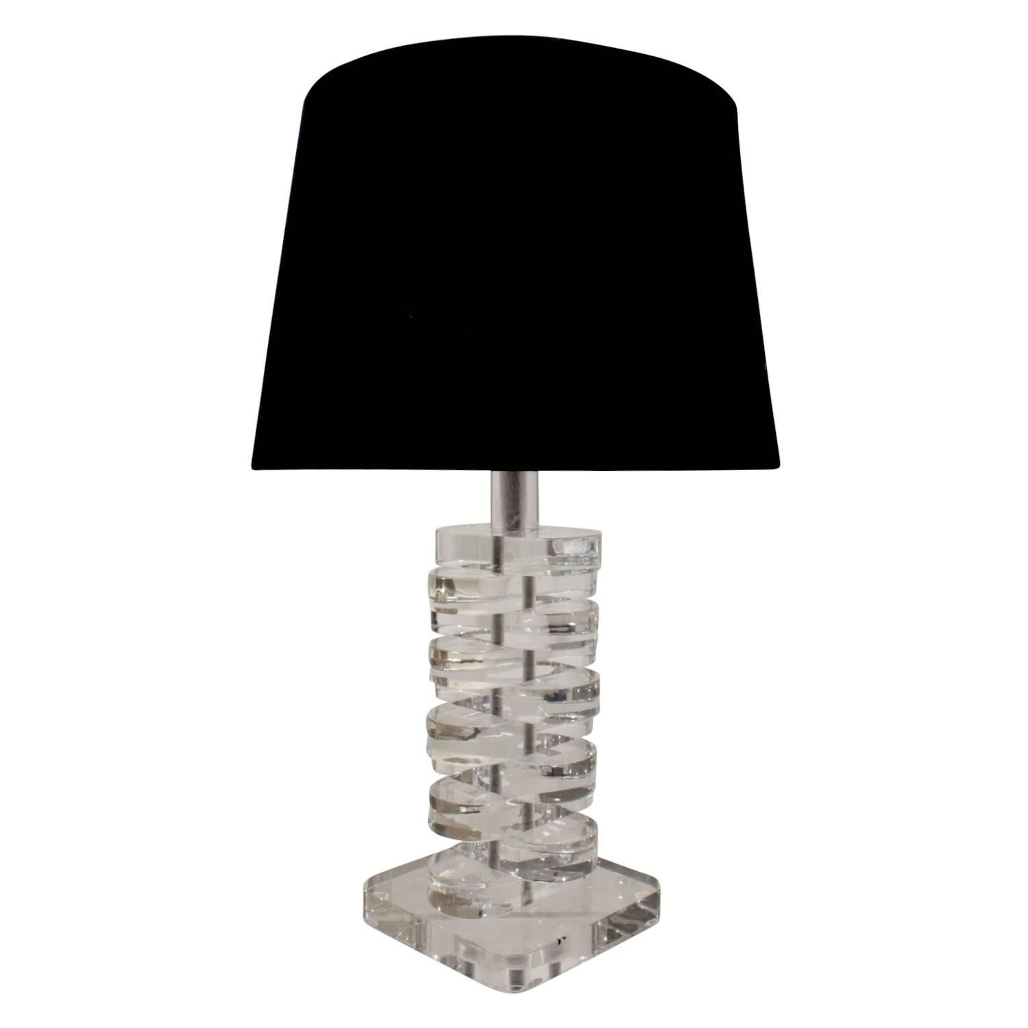Sculptural table lamp with stacked Lucite disk design, American, 1970s. This would be ideal as a desk lamp.

Shade diameter: 13 inches.