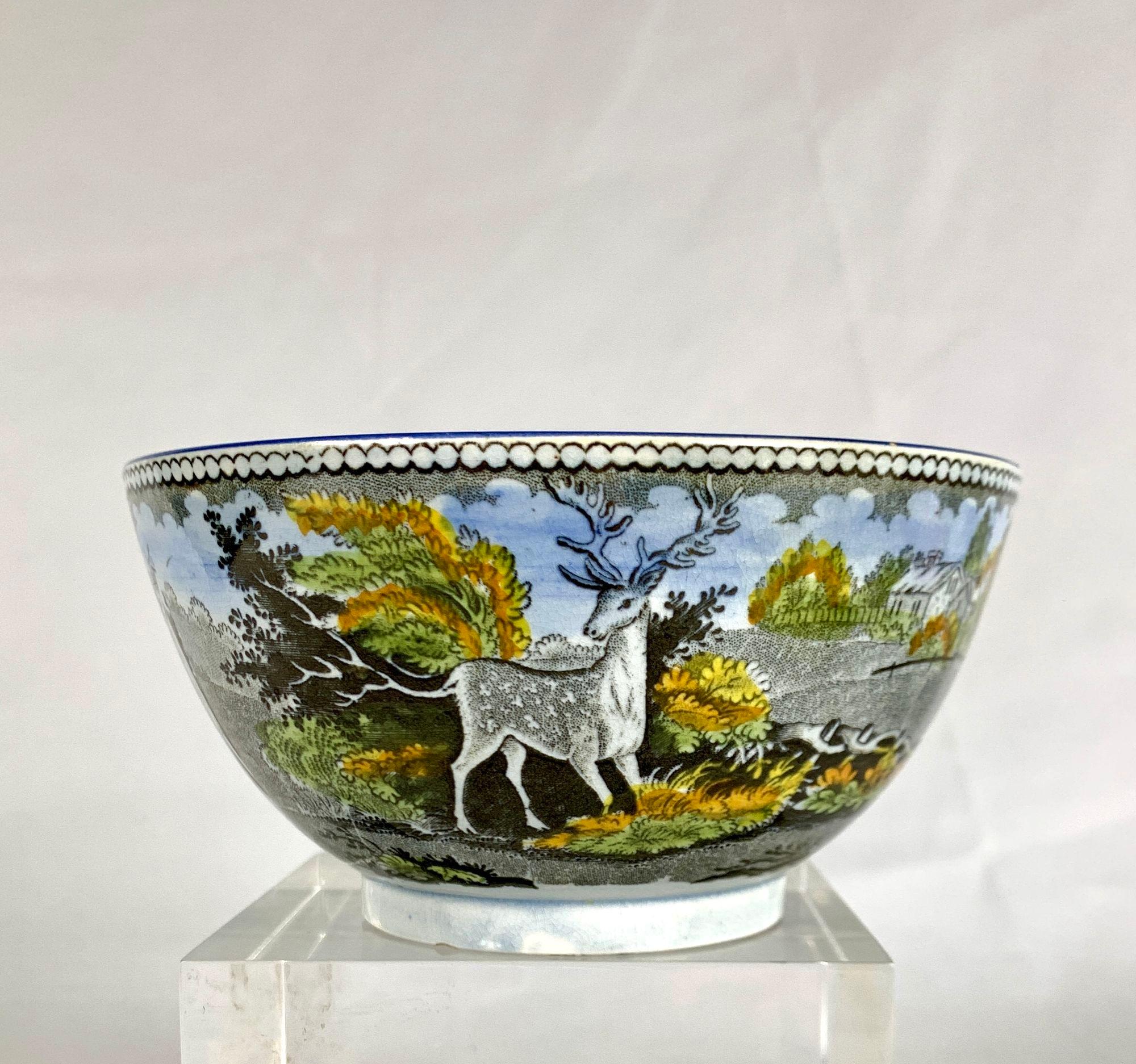 This is a small bowl that displays a beautiful scene of a stag standing at the edge of a clearing.
In the background, there is a small house with a fenced garden.
This type of earthenware is known as Salopian pottery, which was popular in the early