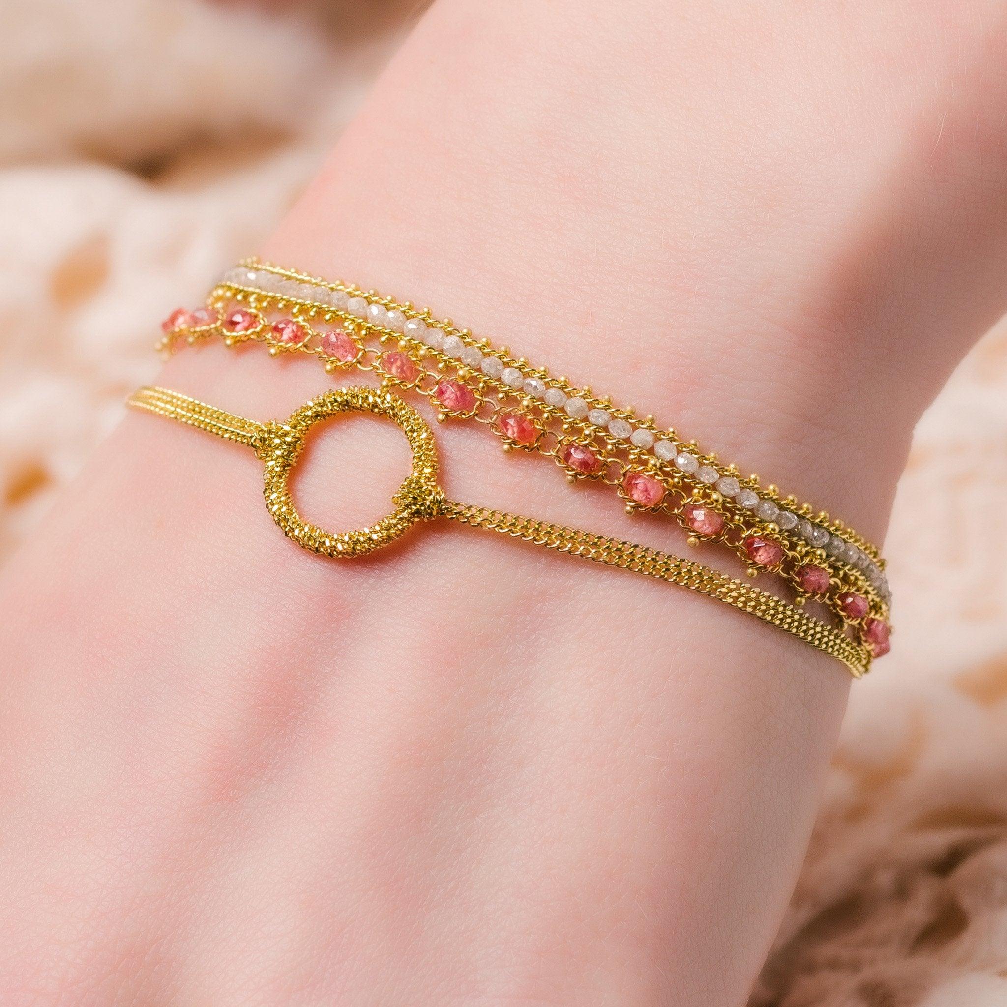 This deceptively simple bracelet has a secret: the links of its handmade, diamond-cut 18K yellow gold chains have the ability to reflect ambient light so brilliantly that you’ll think you’re wearing strands of glimmering starlight. The two luxurious