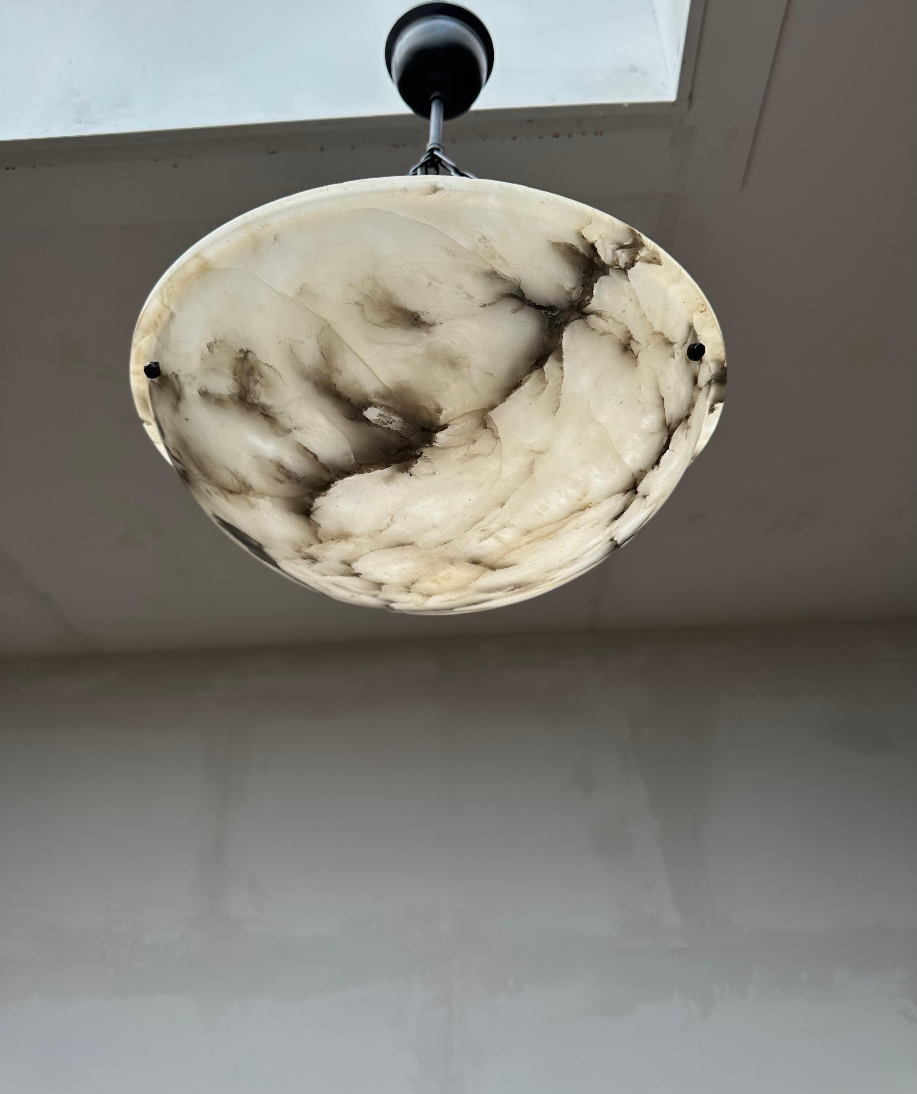 Marvelous antique light fixture for an entry hall, bedroom or any other small room.

With early 20th century light fixtures being one of our specialities, we always love finding timeless alabaster pendants. This particular work of beauty comes with