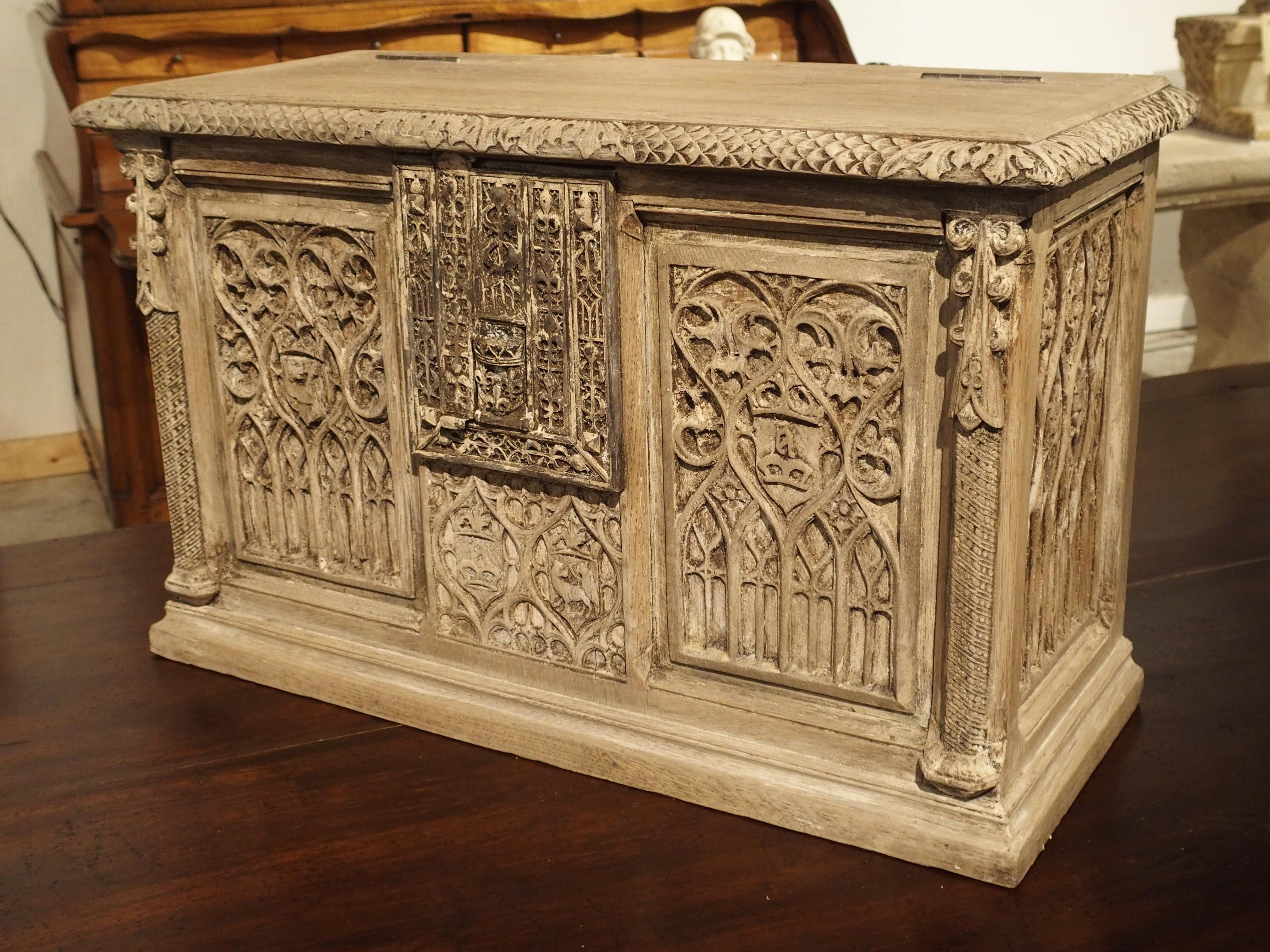 This small French trunk is made from oak and has been stripped at some point in its history. White gesso remains in some areas, which brings out the details in the carvings. It dates to the late 1800’s, however, the panels are from an earlier