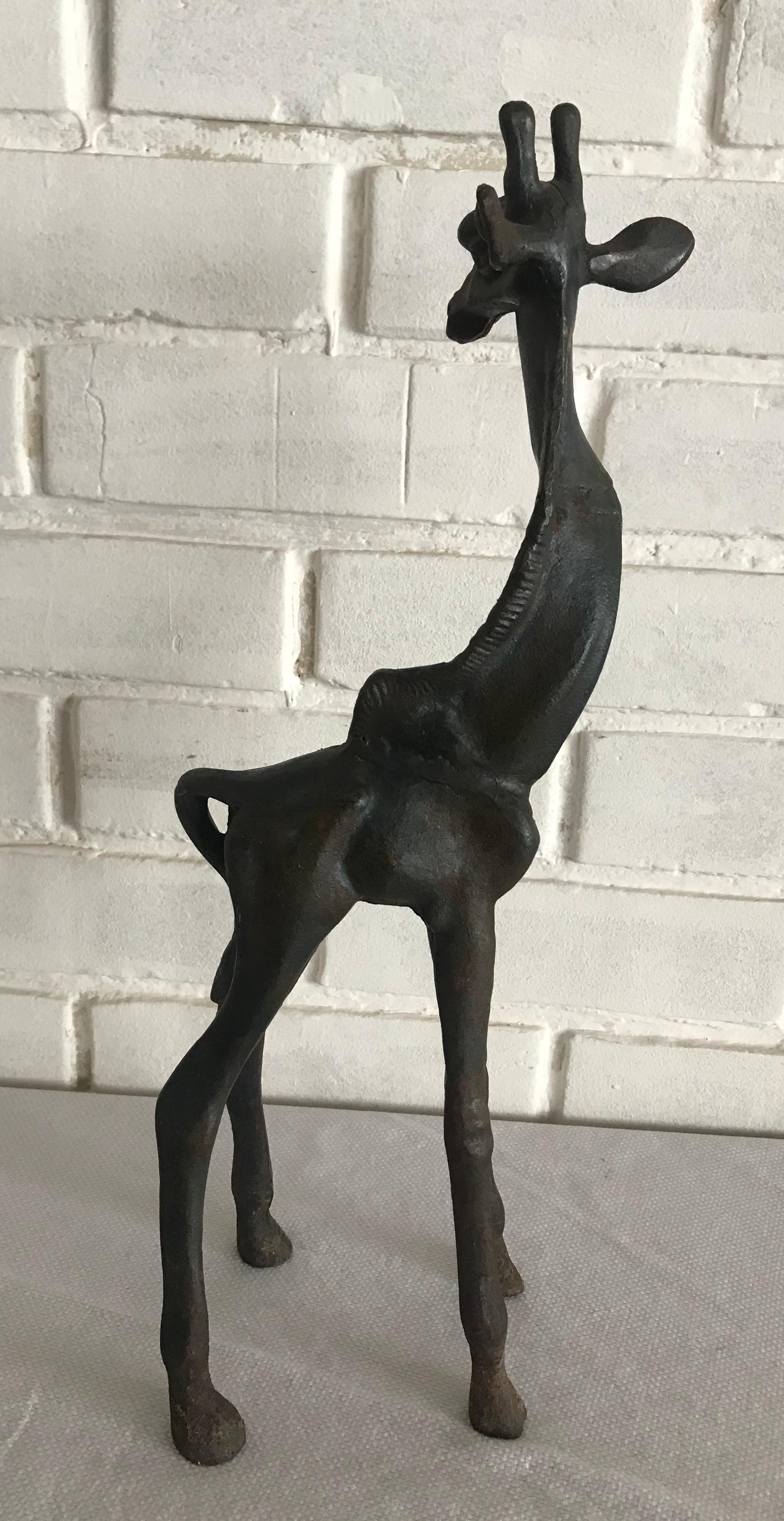 Stunning small cast iron giraffe sculpture.
Unknown artist.
Mexico 1960s. x.


  