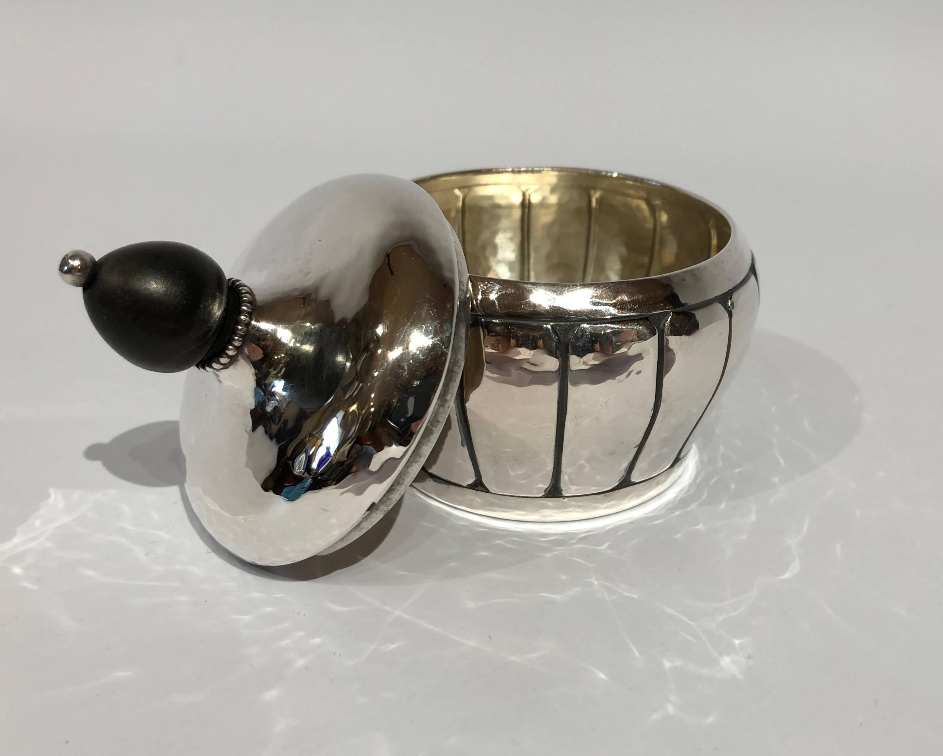 Small sugar bowl in hallmarked silver with pearl edge and ebony handle.