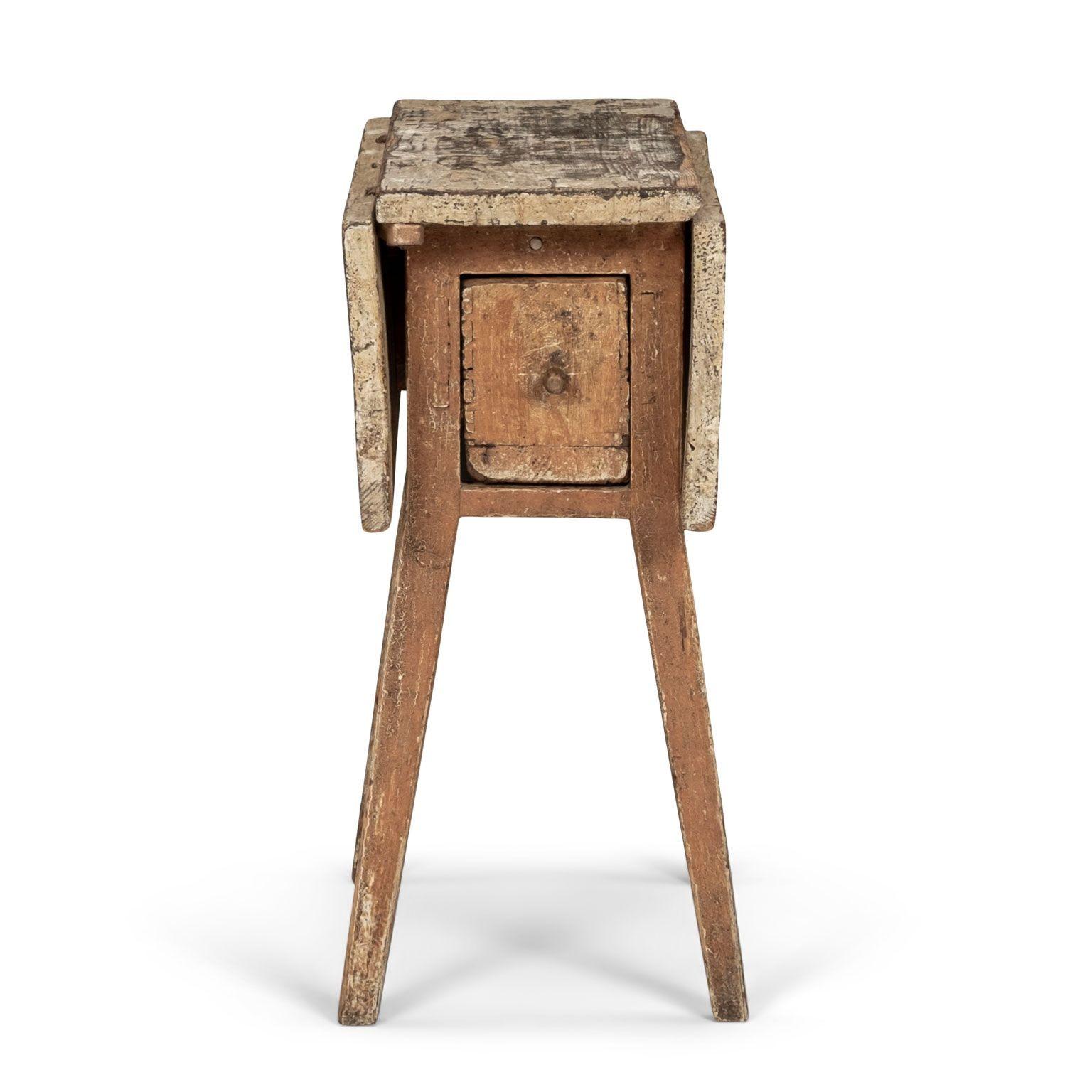 Small Swedish drop-leaf side table with double-sided single drawer in early paint. Sturdy, stable. Circa 1830-1849. Restoration to pull-out supports under drop-leaves.