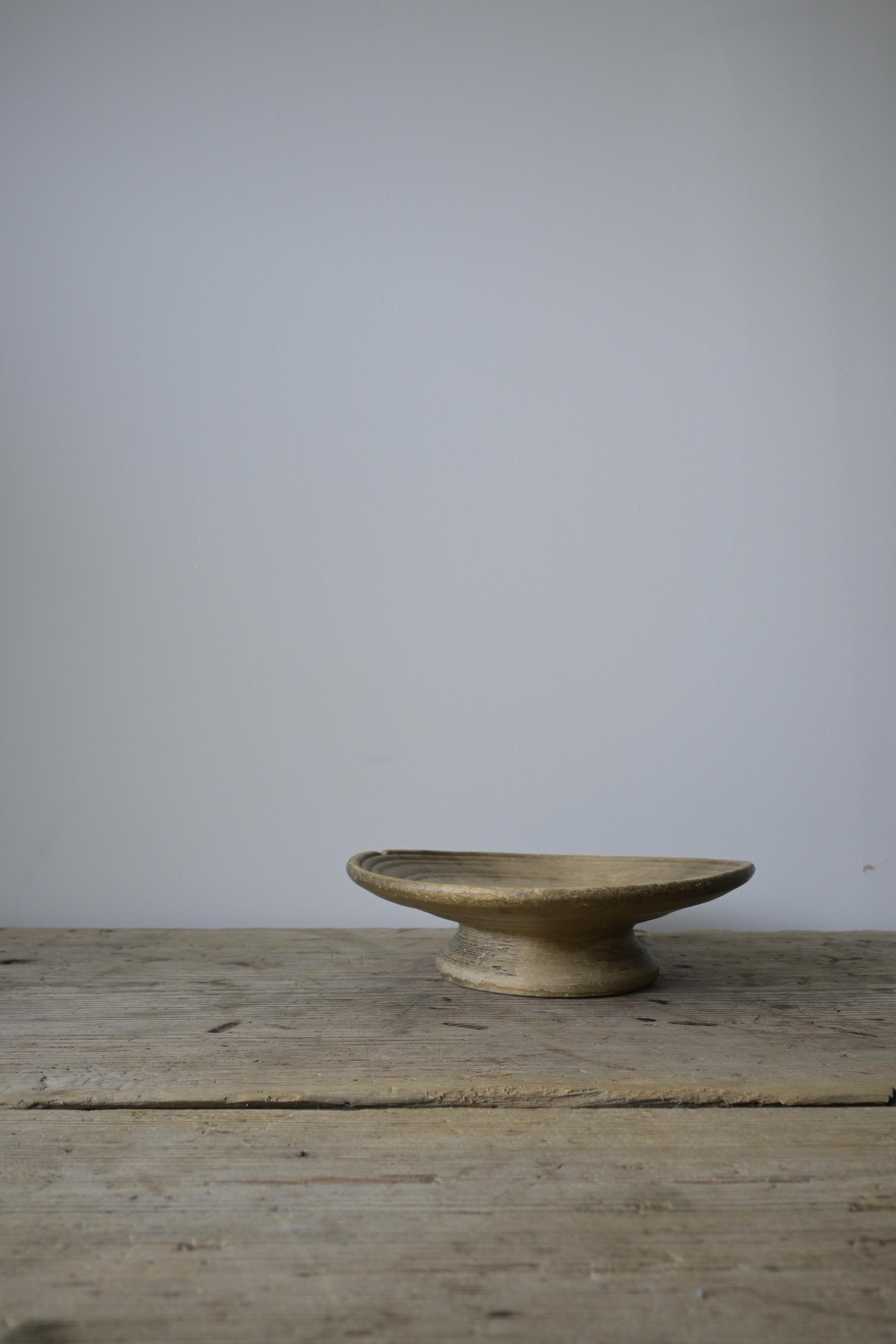 Small Swedish Turned Serving Platter 'Sovelfat' dated 1772

These platters were typically used for meat, which was very expensive in the old days and mainly consumed during the holidays.

Ownermarks and dated 1772.
Made out of birch wood with a base