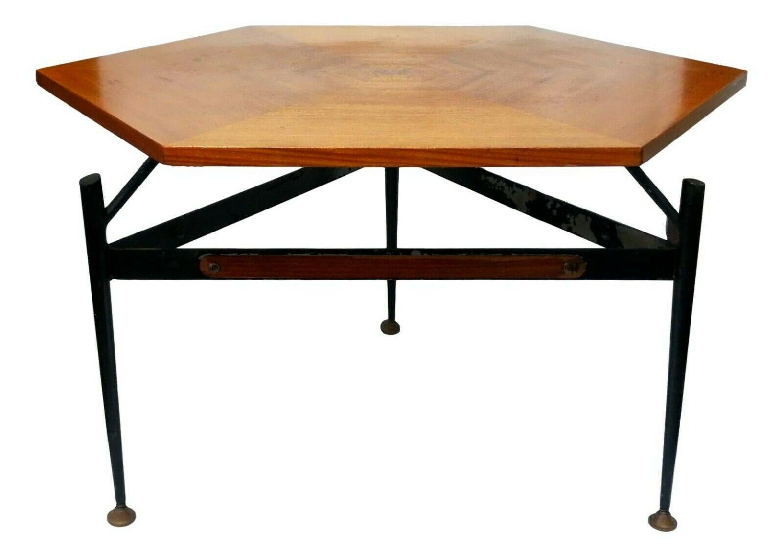 Splendid original coffee table from the 50s, design by silvio cavatorta, made with a metal structure with wooden finishes, teak top made of mosaic in six segments

It measures 42 cm in height, distance between side and side 60 cm, diagonal