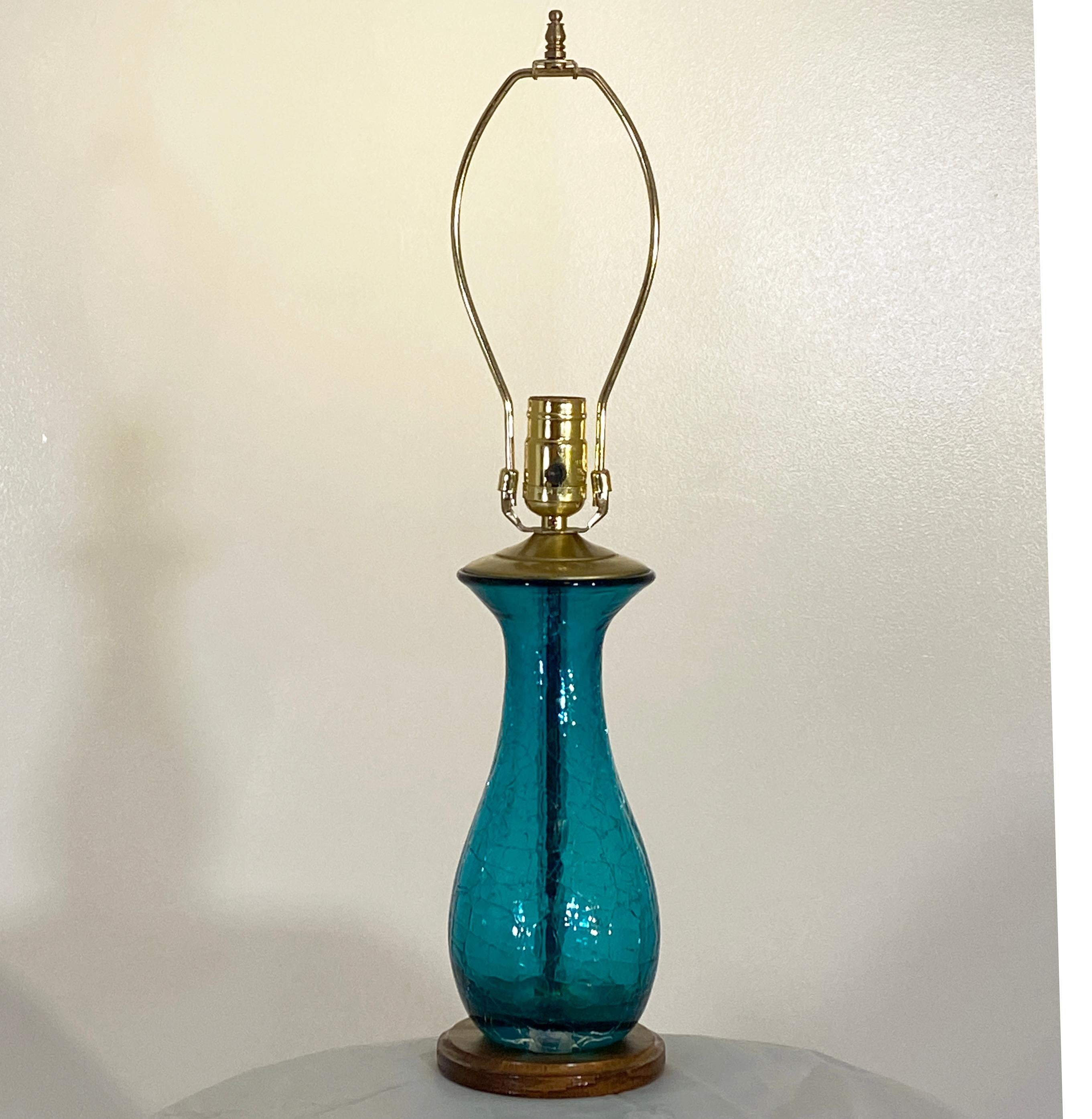 This shape of Blenko has been in the catalog for some time and was reproduced at various times. This however is an uncommon lamp size, diminutive and petite in nature and ideal for a bedroom. It is just 22.5