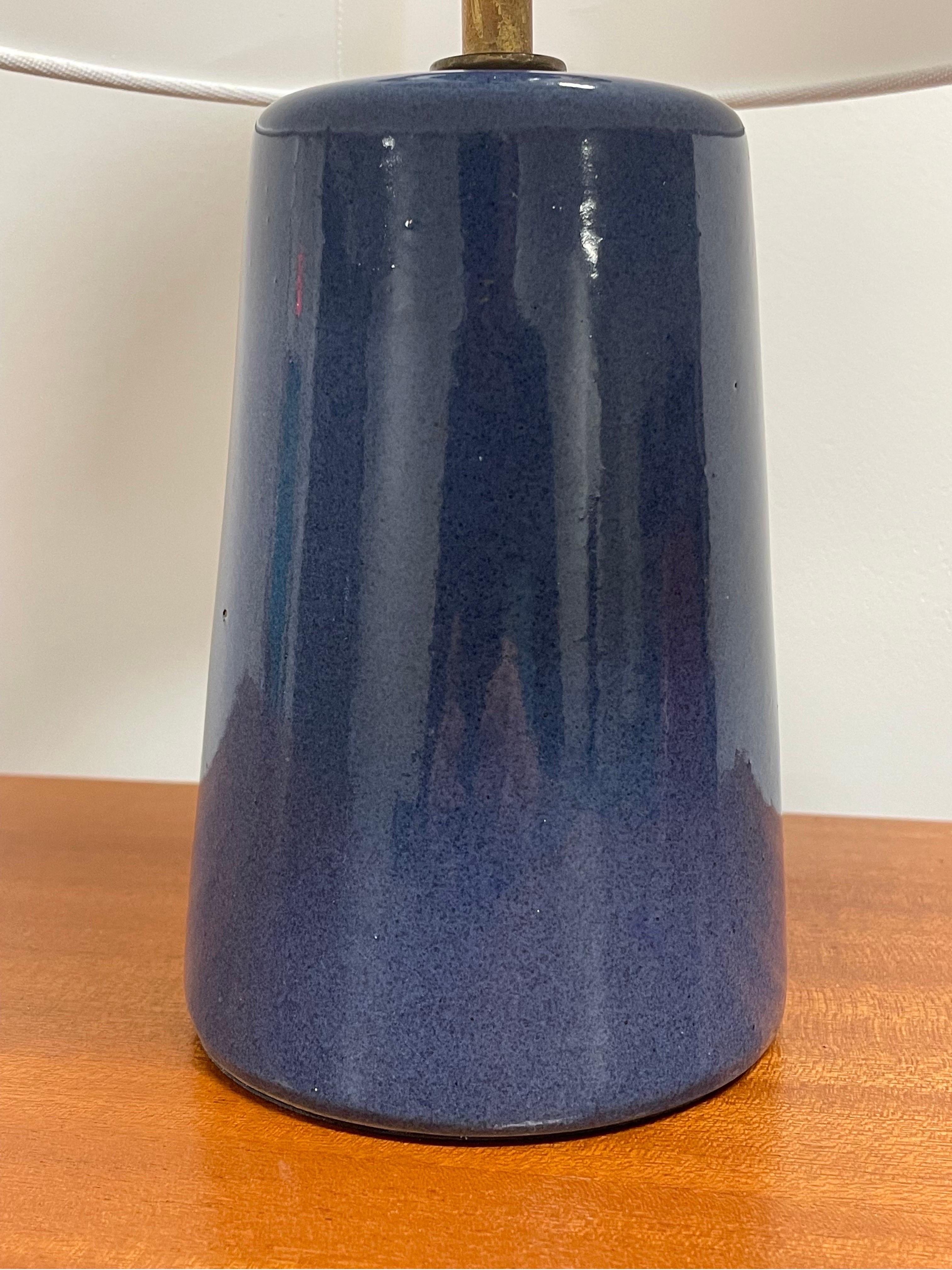 Small table lamp designed by famed ceramicist duo Jane and Gordon Martz for Marshall Studios. Royal Blue body. 

Overall dimensions: 
14” tall 
10” wide 

Lamp only 
10” top socket 
4.25” wide.
