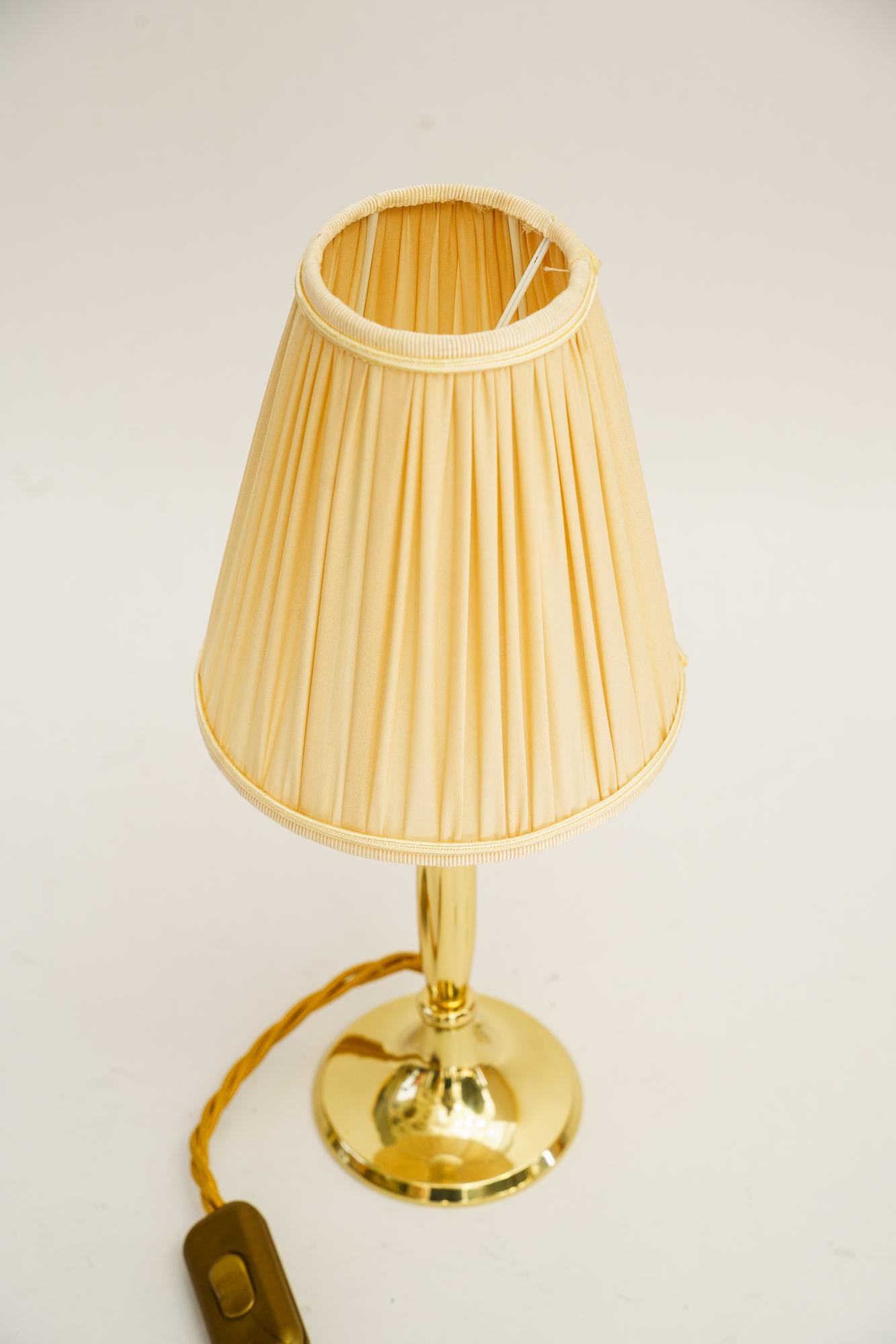 Small Table lamp with fabric shade vienna around 1950s
Brass polished and stove enameled
The fabric shade is replaced ( new )