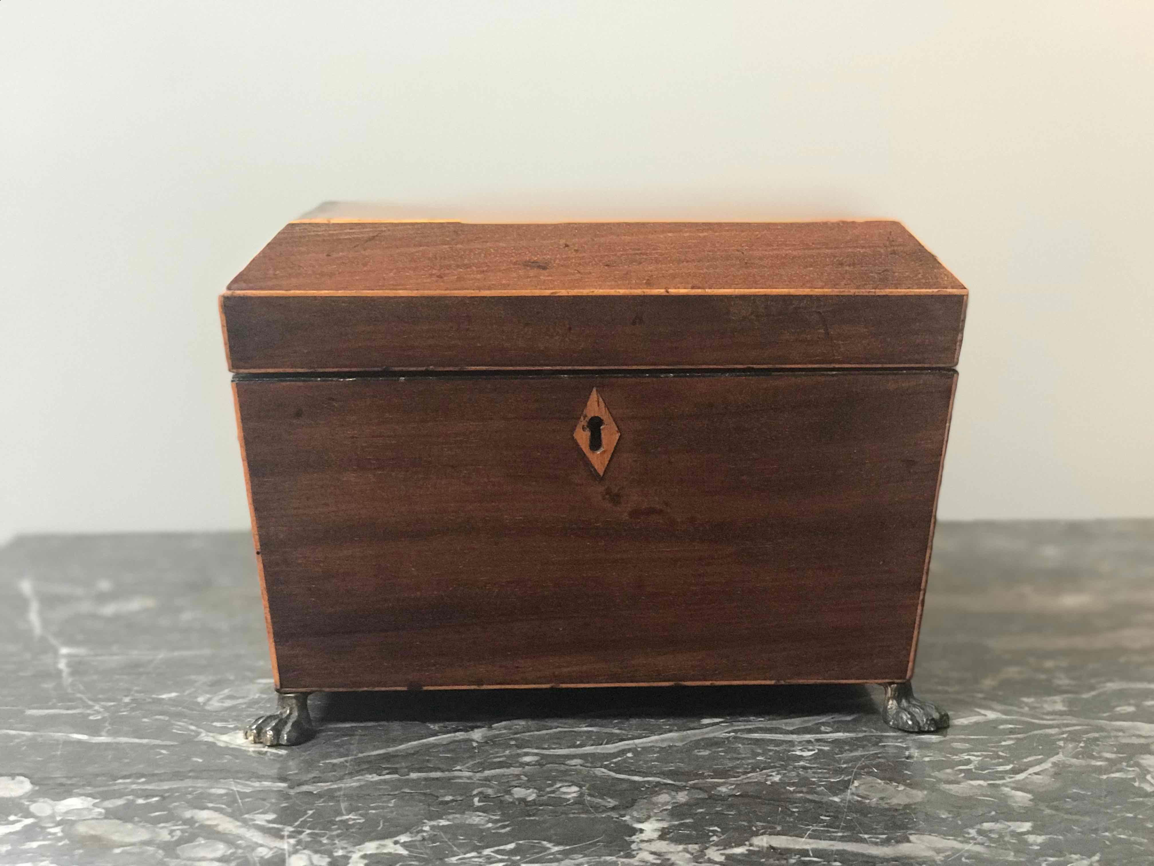 Small tapered inlaid wood box on metal feet from England circa 1880. 