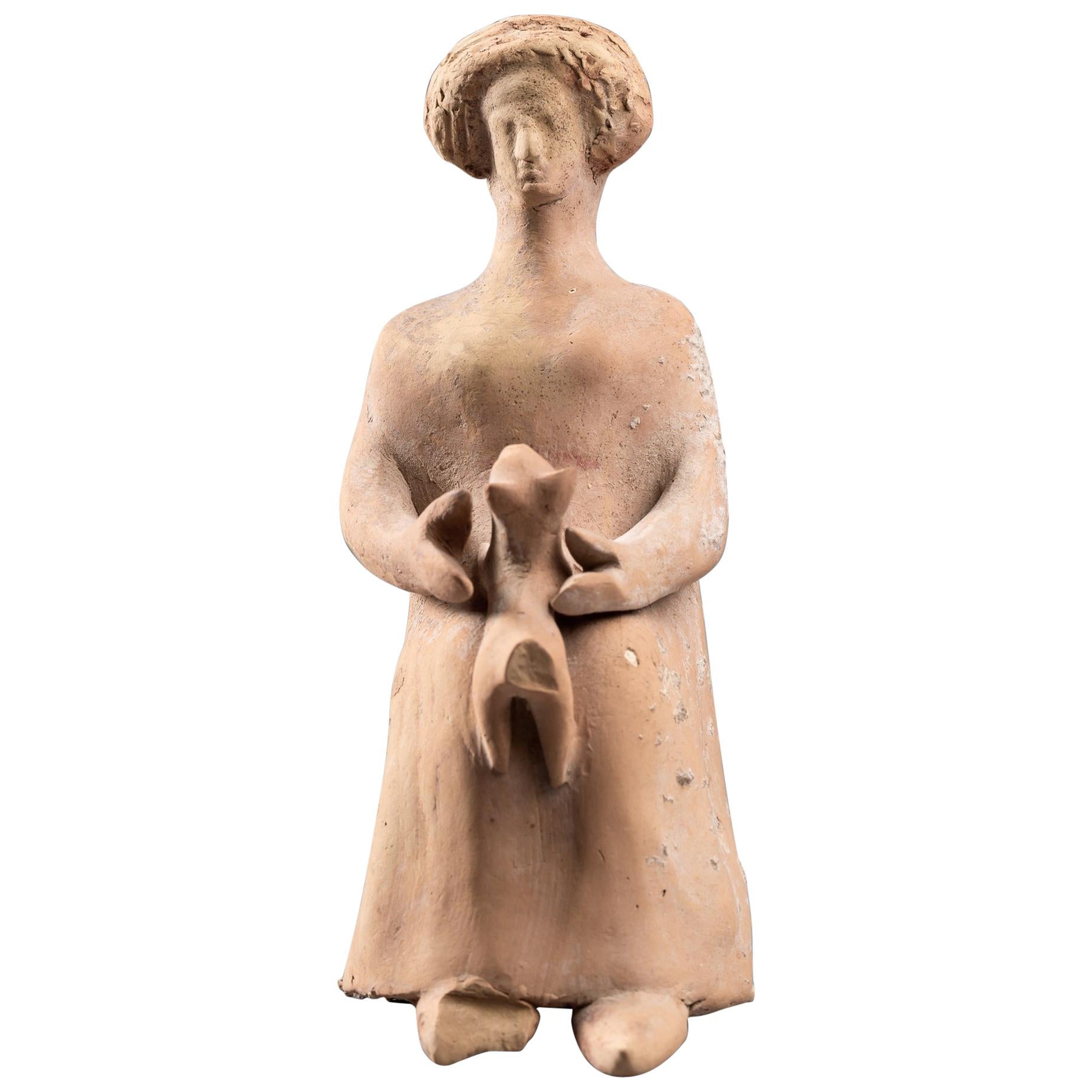 Small Terracotta Woman Figurine Holding a Dog, Greek Art For Sale
