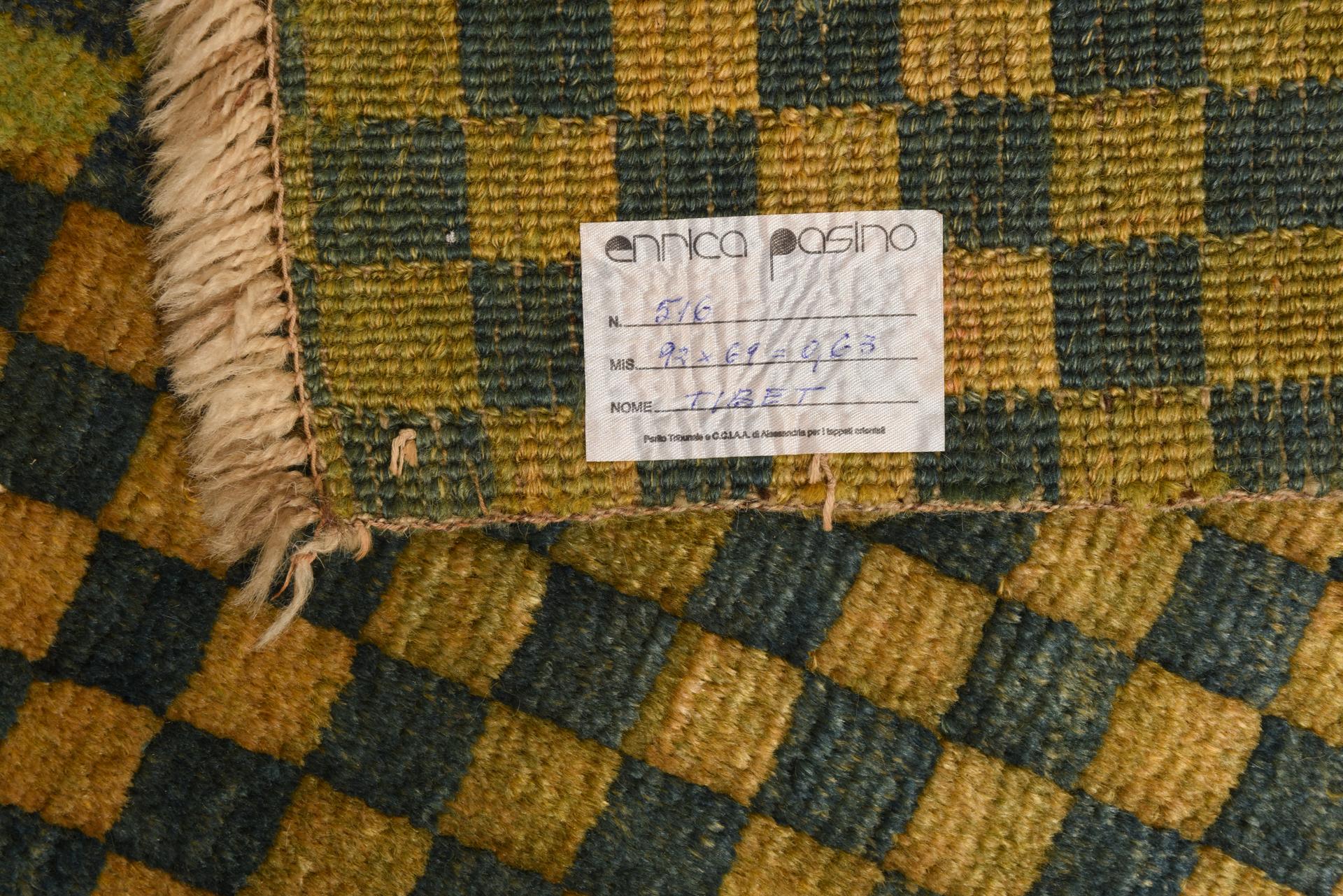Small light yellow and blue checked Tibetan meditation rug.
 Can be placed under a large vase or leaning on the sofa.

ref. nr. 516.