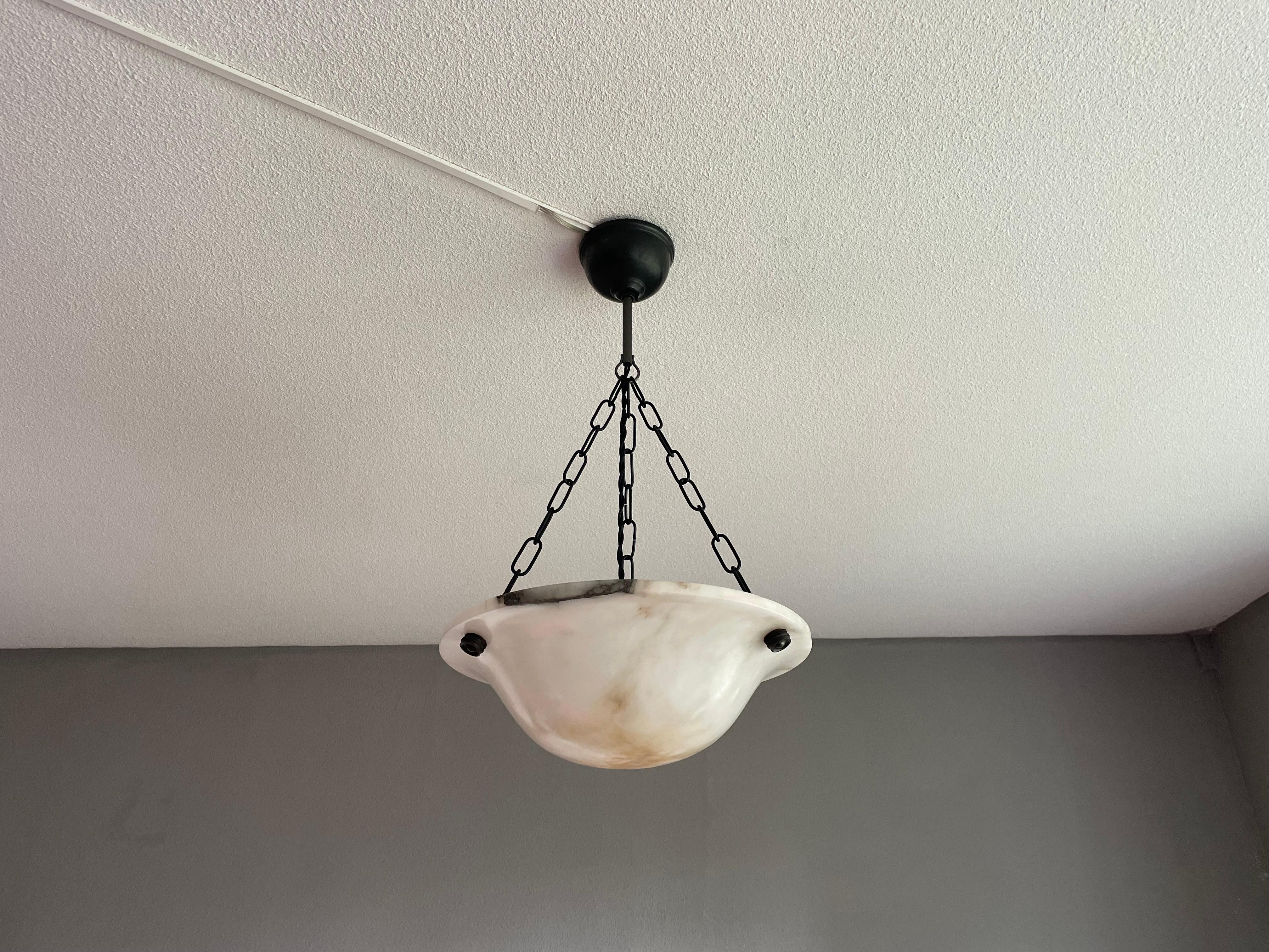 Small and truly timeless pair of small chandeliers that will never fail to impress.

With early 1900s alabaster light fixtures as one of our specialities, finding a very good condition and highly attractive pair of (Art Deco era) alabaster pendants