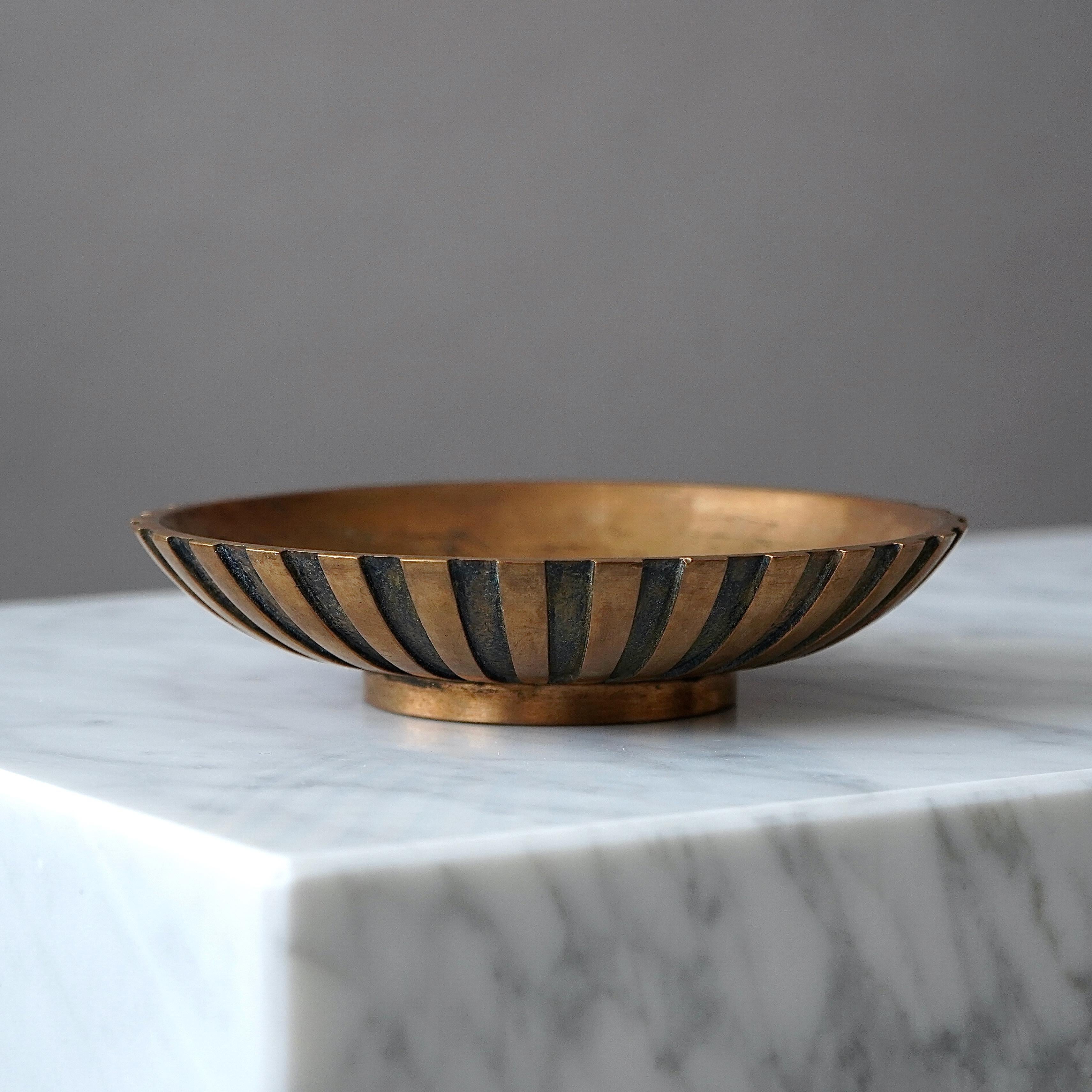 A small but beautiful art deco bronze bowl with amazing patina. 
Made by Tinos in Denmark, 1930s.

Great condition. 
Stamped 'TINOS', 'BRONCE' and 'MADE IN DENMARK'.