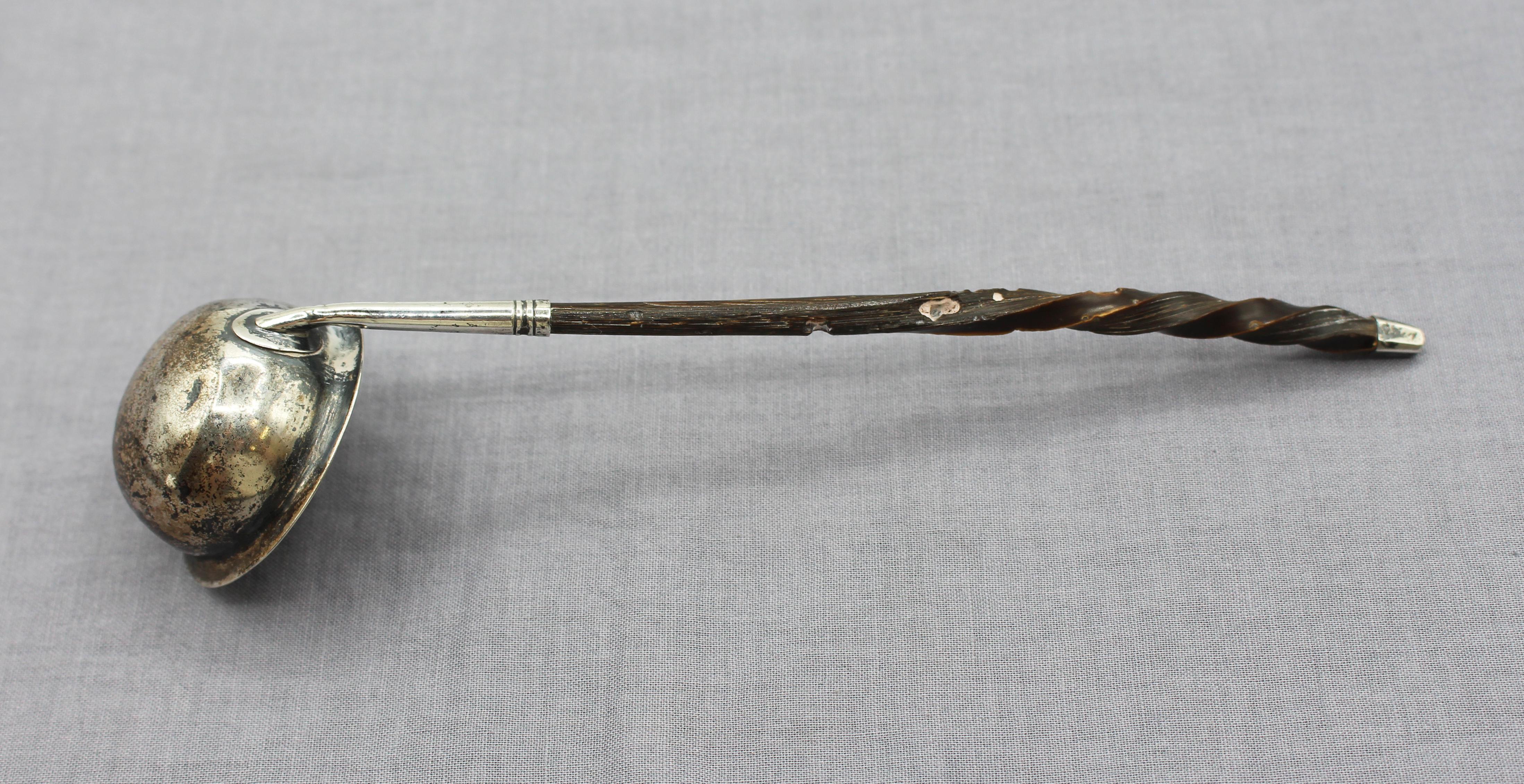 Sterling & twisted baleen handle small toddy ladle, London, 1800. Probably by John Sanders. Sterling tip. Worm damage to the baleen. Bowl with minor dents. Hallmarks in bottom of the bowl. Monogram on the exterior.

7.25″ x 1.75″ x 1.75″.

We are a