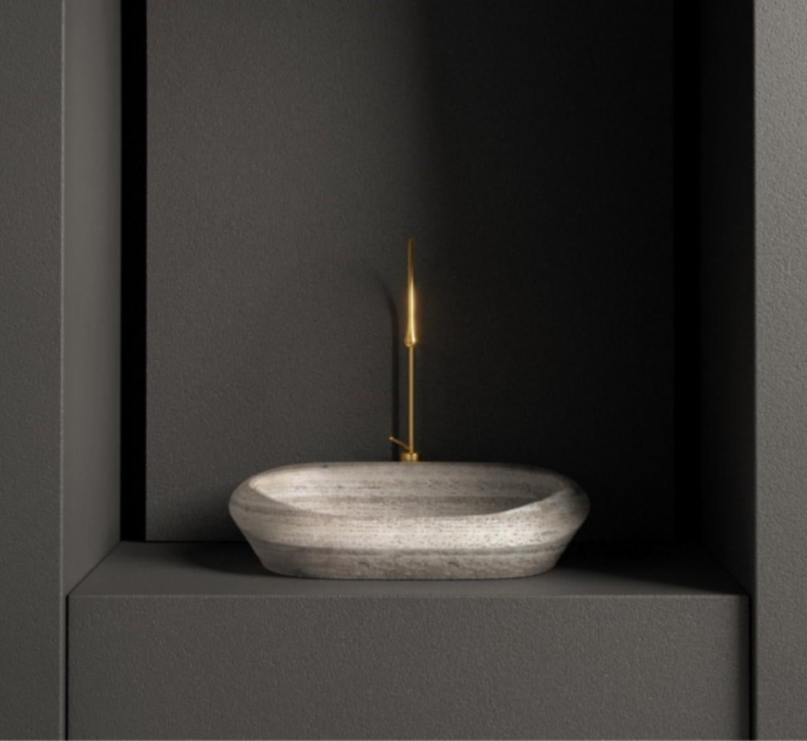 Small Travertino Silver Tosca Washbasin by Marmi Serafini
Materials: Travertino Silver marble.
Dimensions: D 44 x W 58 x H 17 cm
Available in other marbles.
Tap not included.

Tosca is a magnificent washbasin made of a single solid piece of