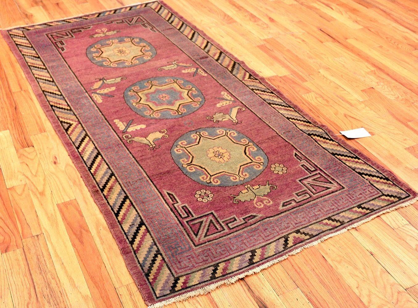 Early 20th Century Small Tribal Purple Antique Khotan Rug. Size: 4 ft x 8 ft (1.22 m x 2.44 m)