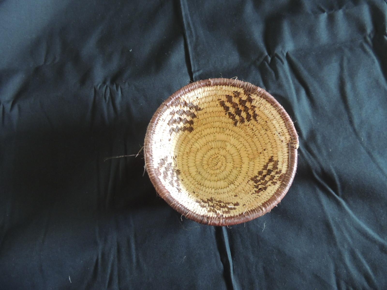Small tribal woven basket in natural and brow
Size: 6