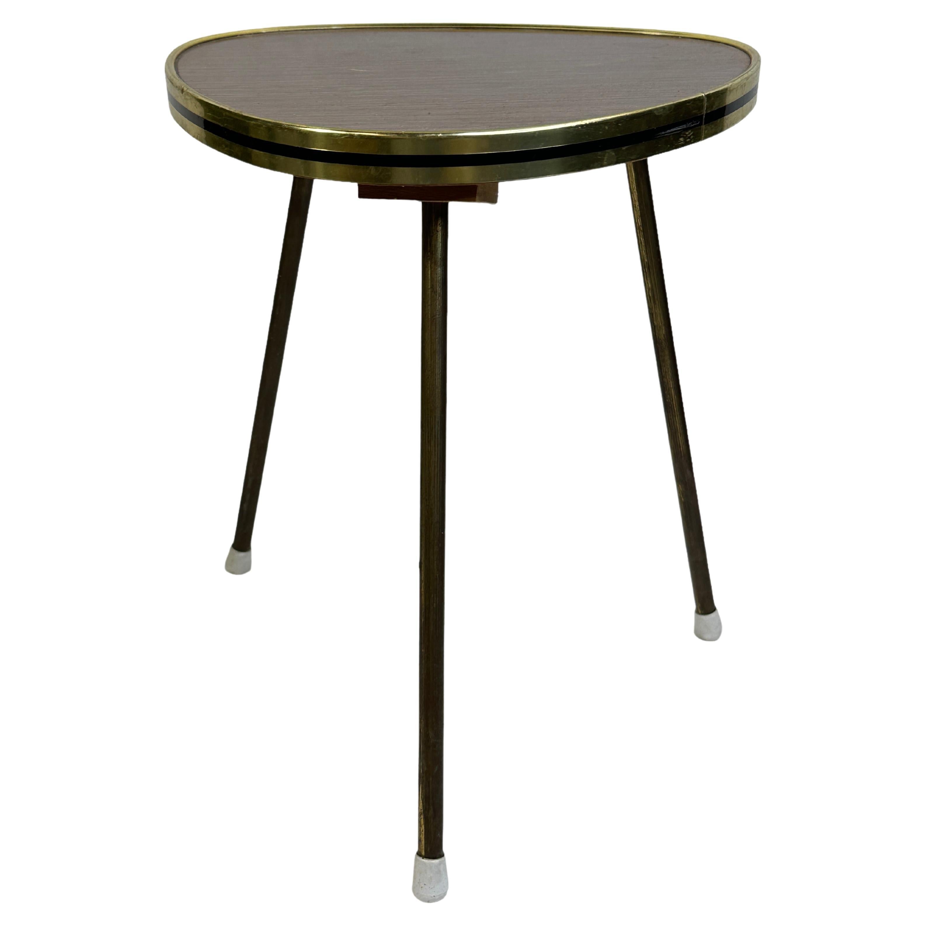 Mid-20th century modern garden stool, flower pot seat or side table. Made of Plywood with brass legs. Nice addition to your home, patio or garden. Also great as a drinks stand in your pool area. Found at an estate sale in Vienna, Austria. 
    