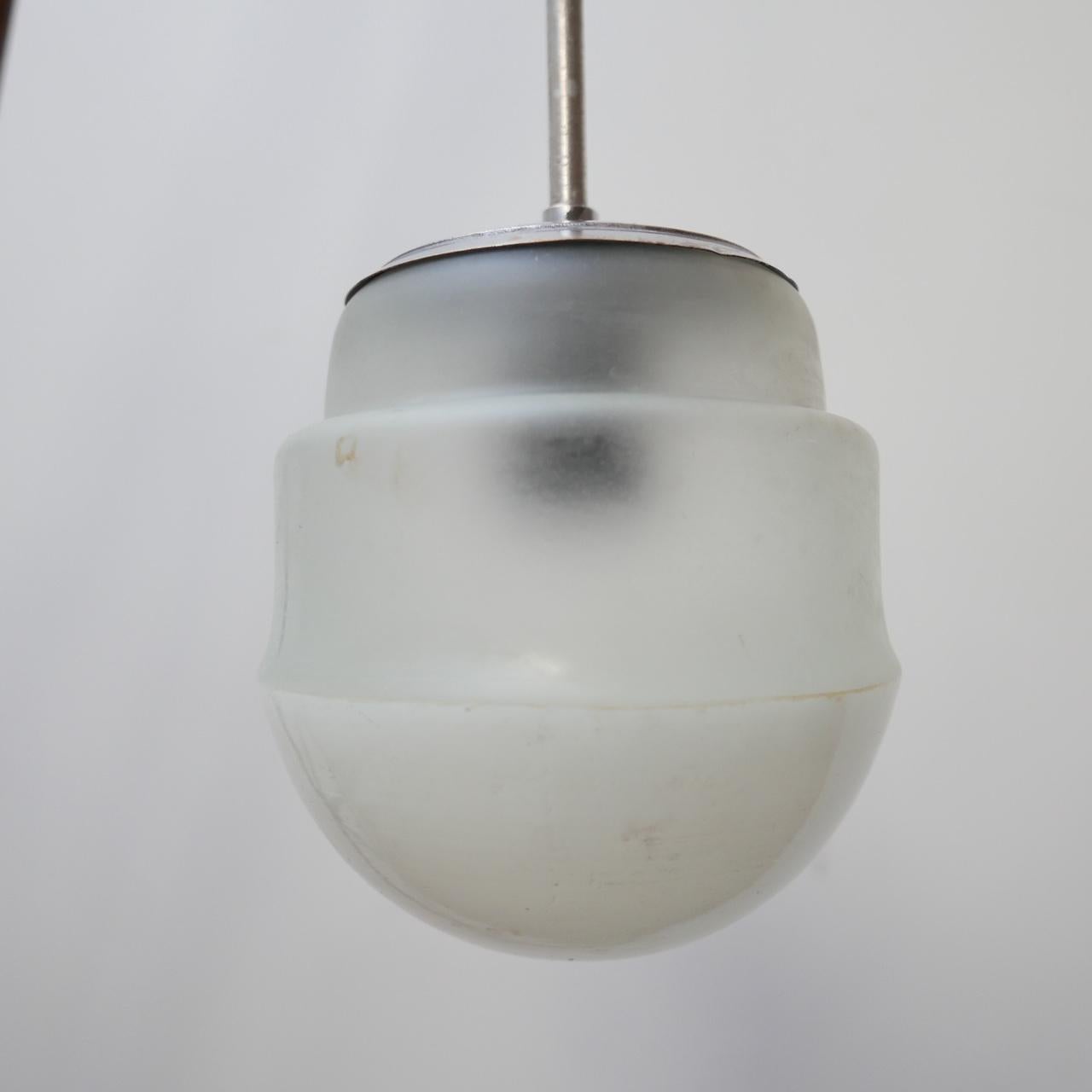 A German diminutive two tone glass pendant light. 

Etched glass top with white glass base. 

Germany, c1950s. 

Good condition, some scuffs and marks commensurate with age, re-wired and PAT tested. 

No rose or chain was retained, the