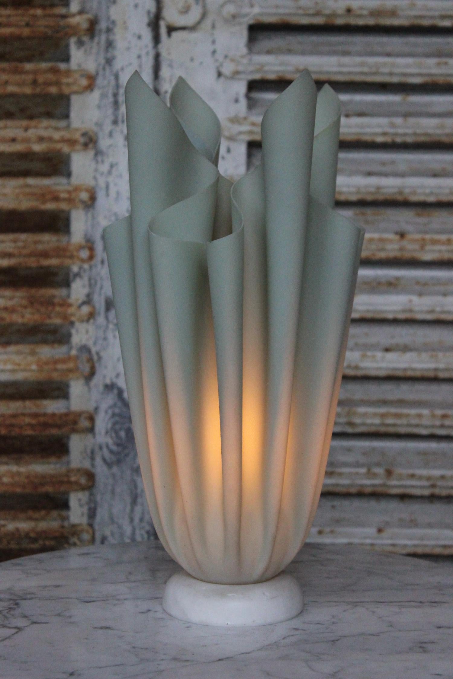 This French 1970s “handkerchief” table lamp was designed by Georgia Jacob and is made of polyester and resin. It has an alabaster base and glows beautifully. This is part of a set and other sizes are available. Very good condition.

Ref #: