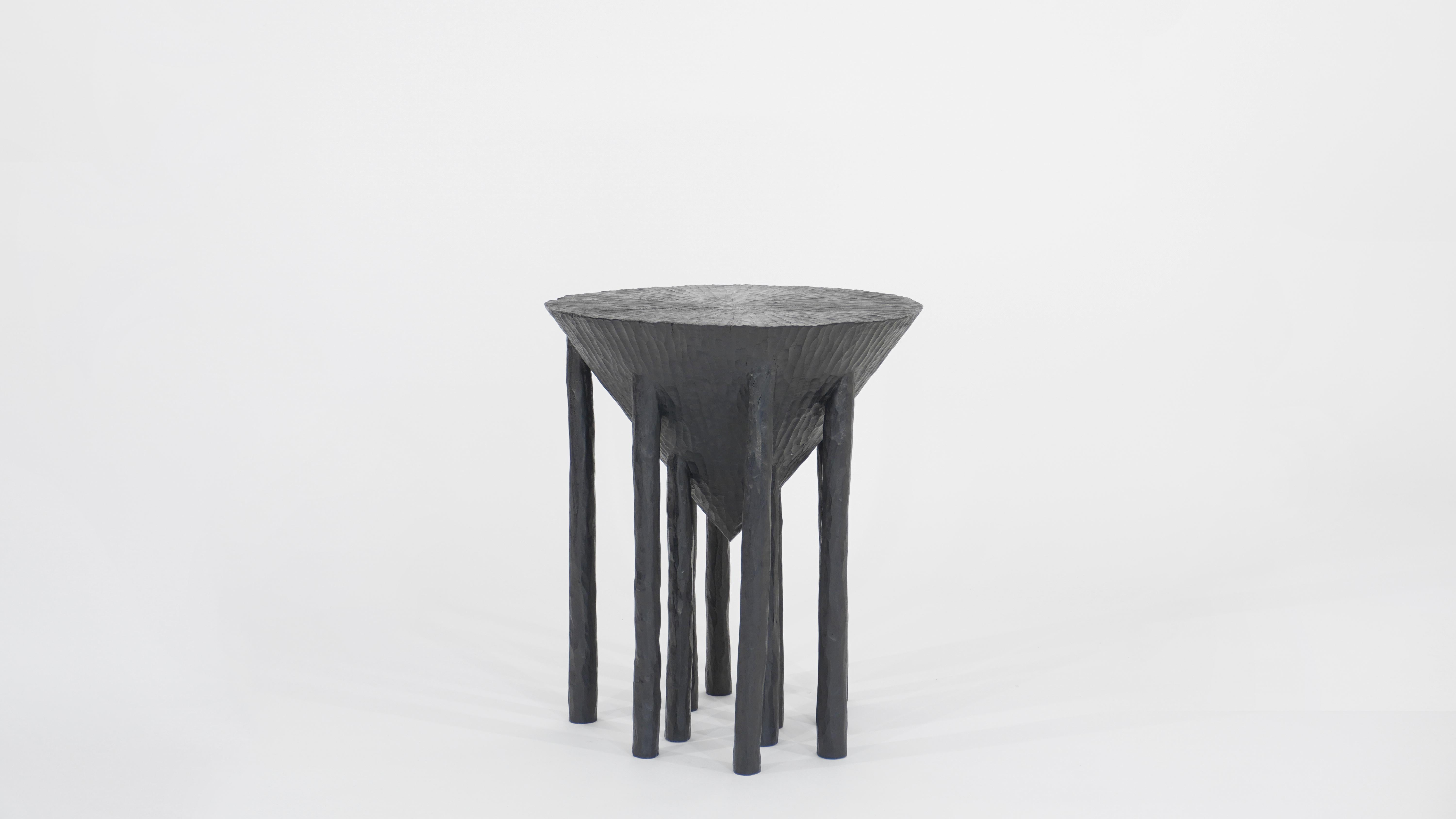 Small Untitled Side Table by Henry D'ath
Dimensions: D 50 x W 50 x H 55 cm
Materials: Wood.
Available finishes: Black ink. 

Carved by hand from a single wooden log over many months, this series of tables is shaped with a consideration of what the