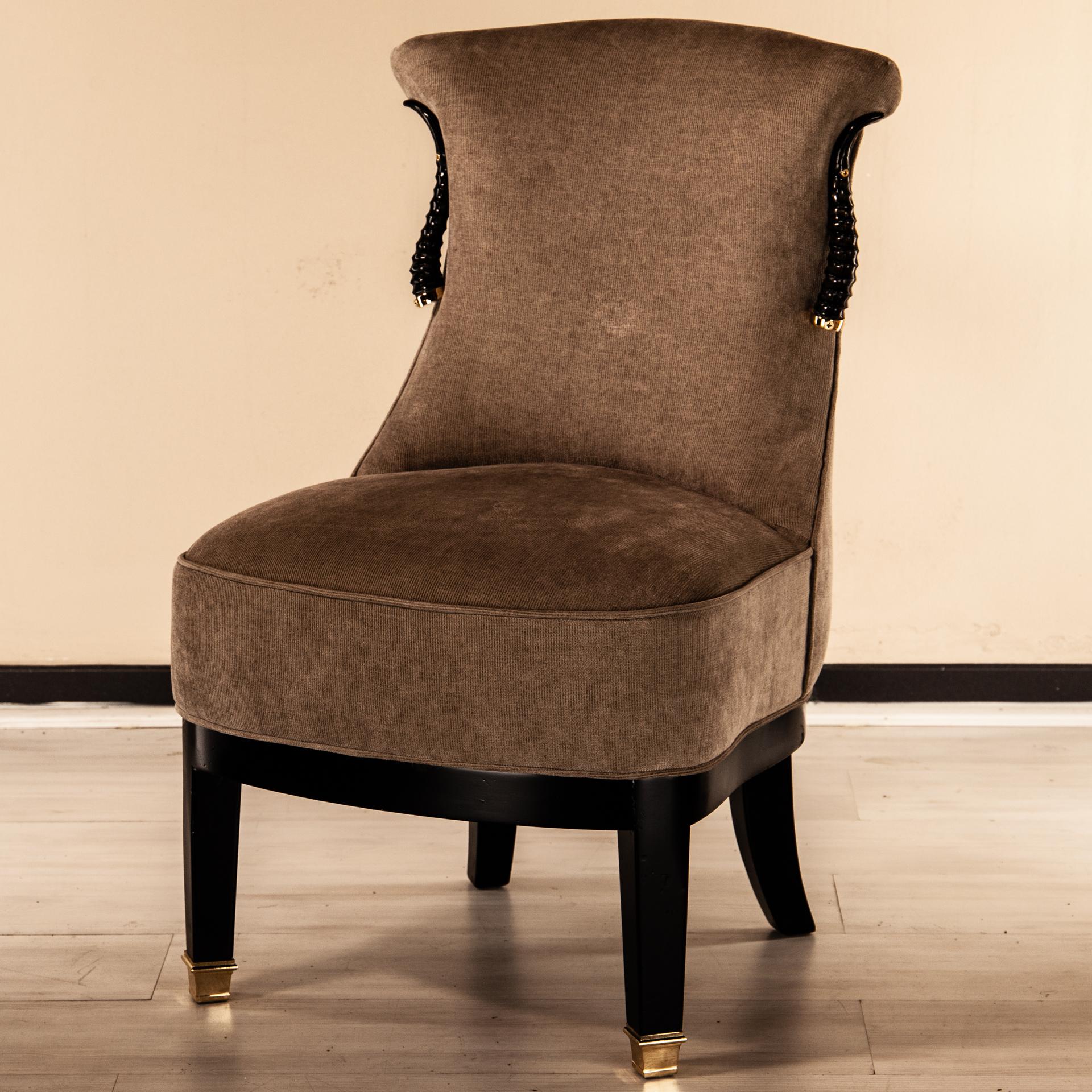 Armchair with real gazelle horn gazzella, shown upholstered in fabric, with piping stitching.
Fully padded upholstery. All metal parts are solid brass.

Accent chair to be placed next to a sofa or framing a low consolle.

Recaptures Anthony