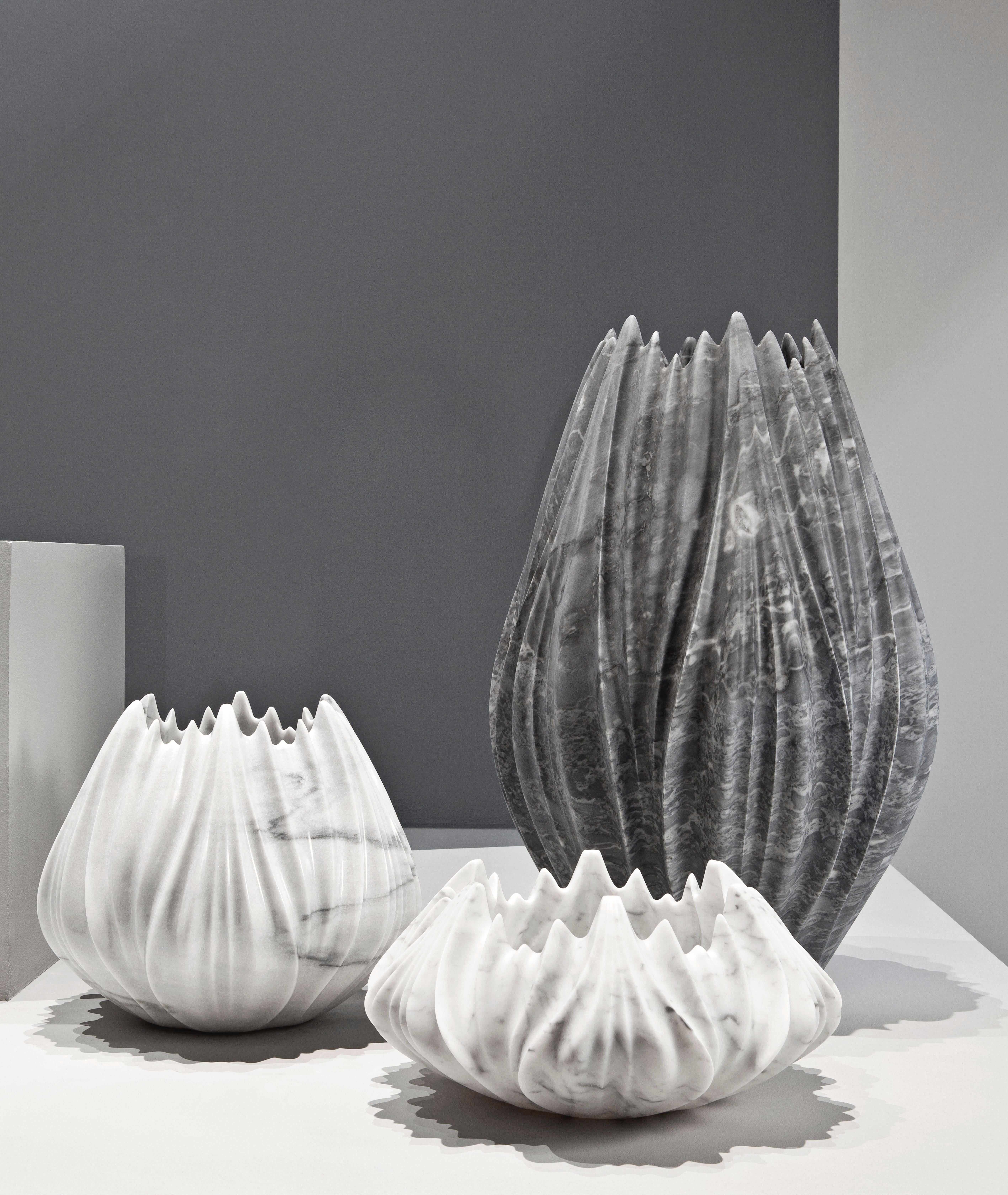 Created by Zaha Hadid together with polished statuario marble. This series includes 4 other designs. Limited edition of 24

The Tau vases created by Zaha Hadid appear organic; emerging as a series of intricately rendered pleats expressing the formal