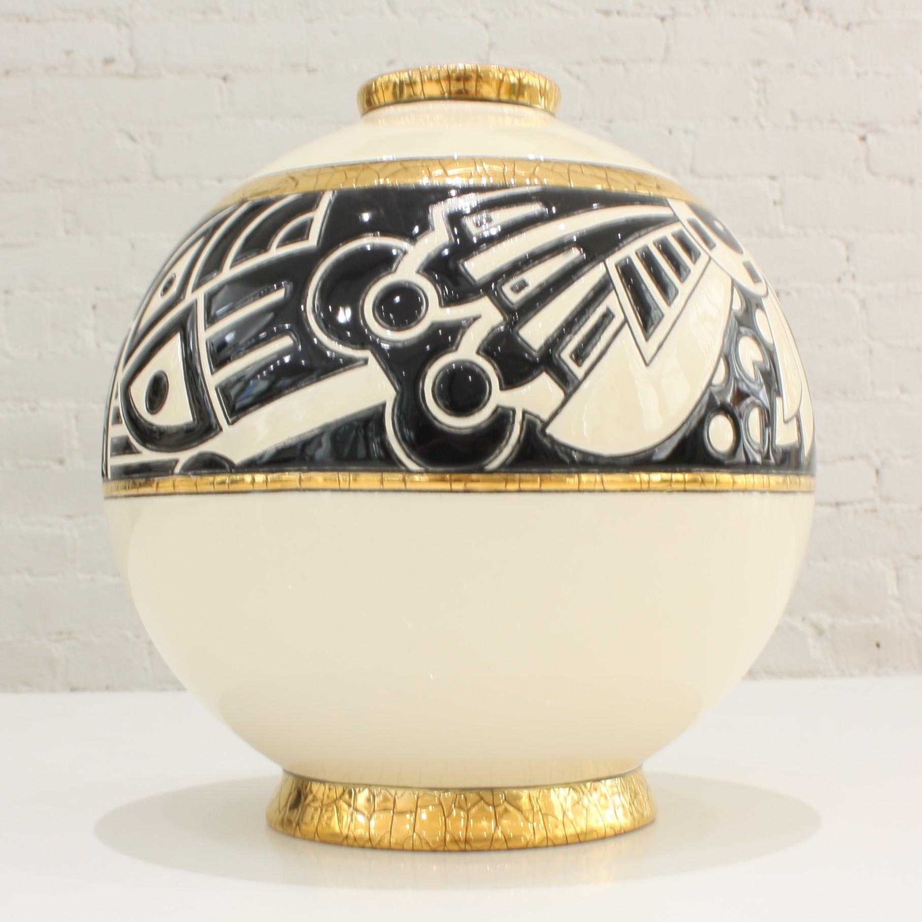 Superb round vase in Art Deco style. The artist Nicolas Blandin was commissioned by Les Emaux de Longwy to create this graphic design for their world famous Boule vases. Black and ivory tones highlighted by crackled gold leaf give a refined touch to