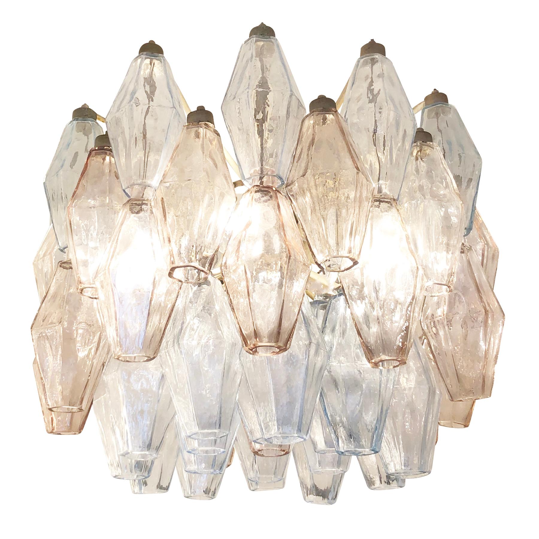 Midcentury chandelier by Venini made with their iconic poliedri Murano glasses. The glasses are a mix of light blue ones and light rose’ ones mounted on a white lacquered frame. Ready to hang on a chain.

Condition: Excellent vintage condition,