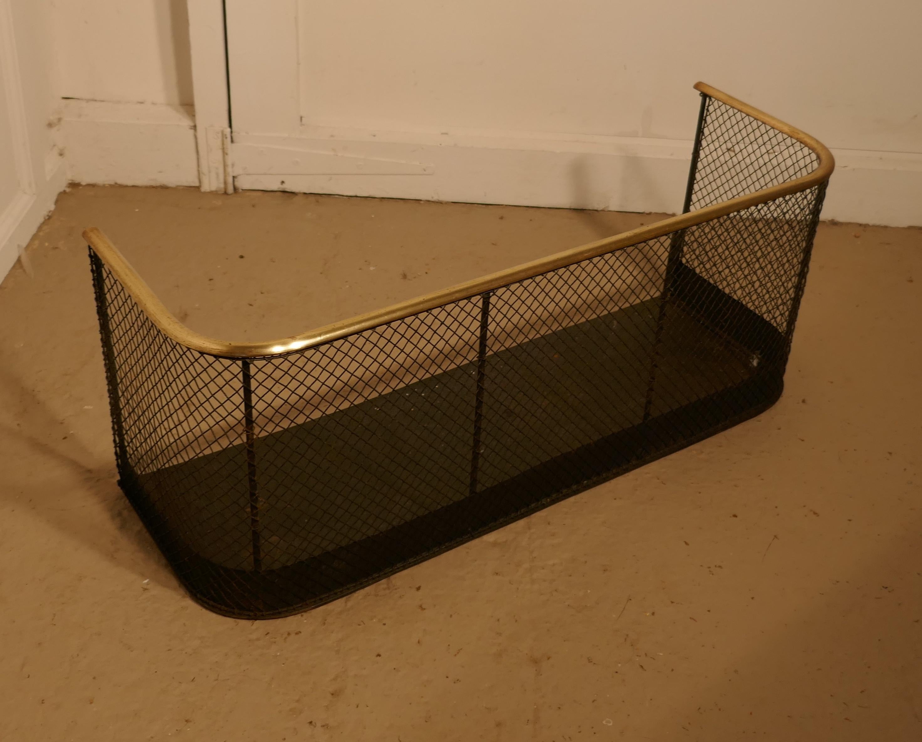 Small Victorian nursery fire guard or club fender 

A Victorian antique club fender often known as a nursery guard as it completely surrounds the fire
The slightly curved brass topped rail is in very good order as is the wire mesh
The fender is