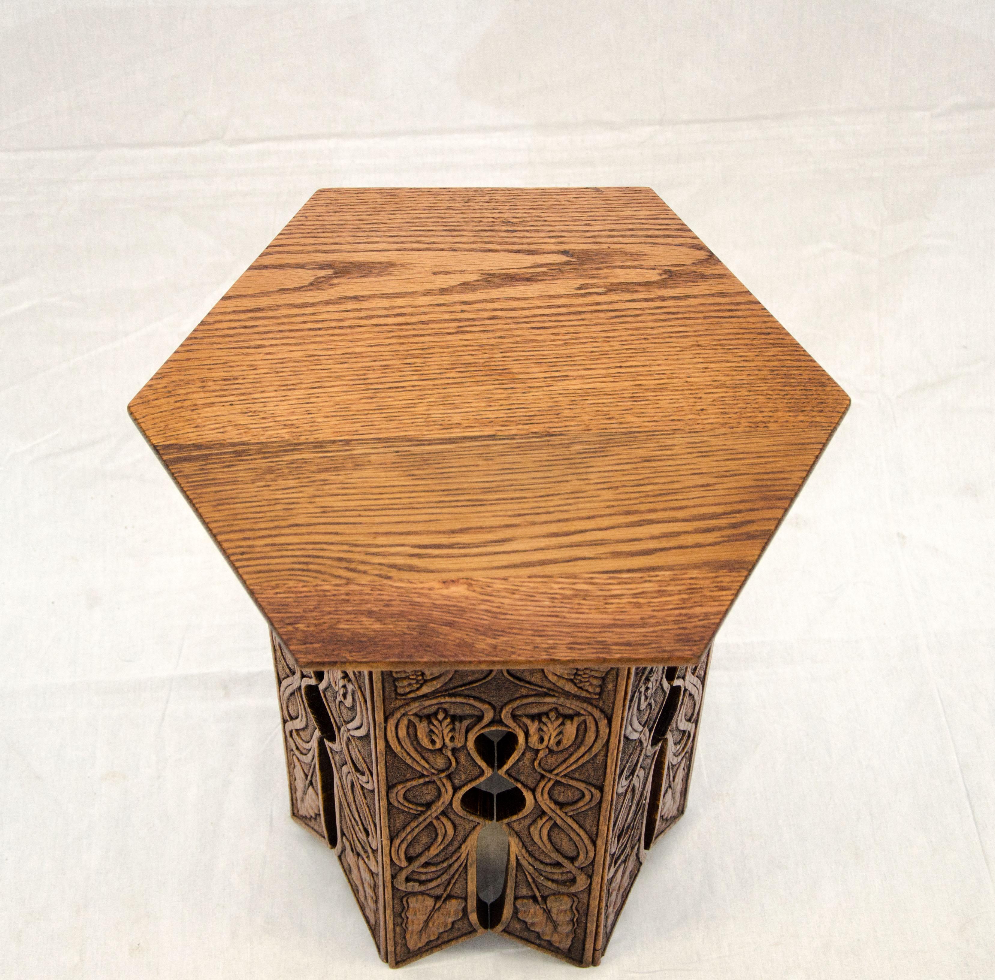 Very nice small Victorian tabouret table or plant stand which would also serve well as a small occasional table next to a lounge chair. On each section of the base the decorations were machine pressed and depict a very Art Nouveau vibe.