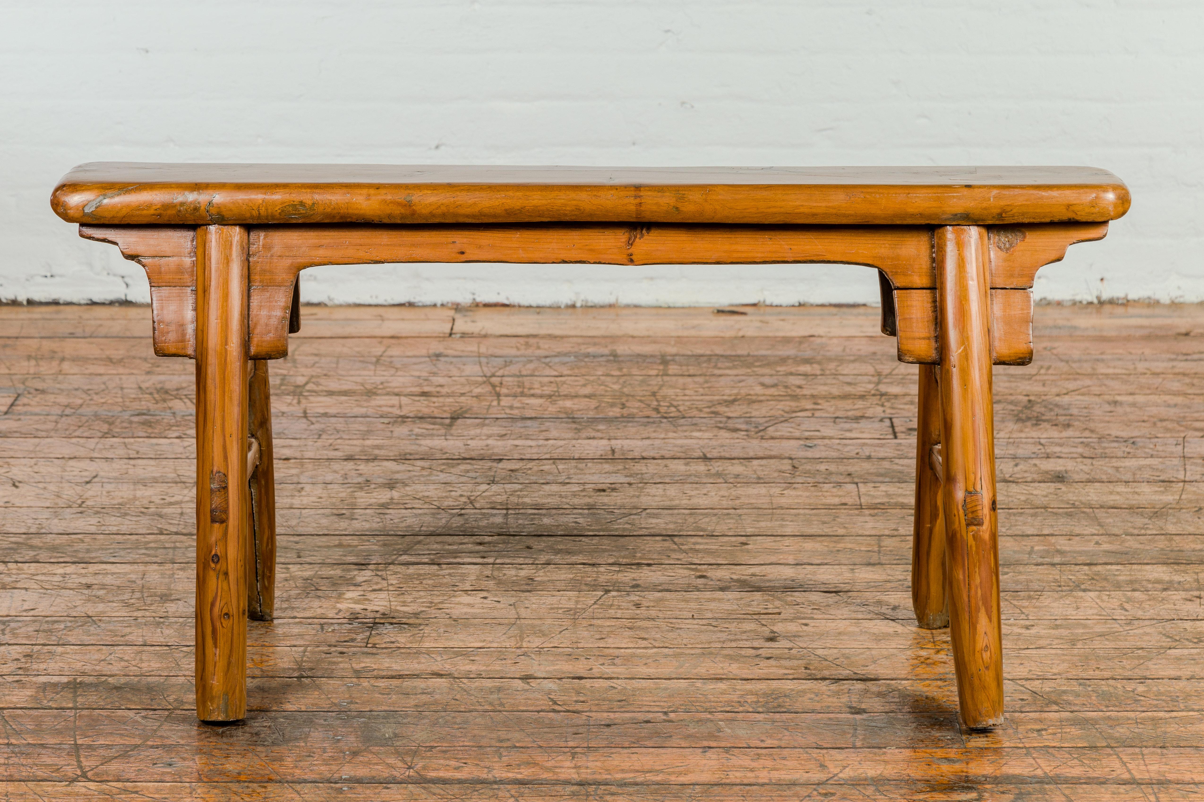 Javanese Small Vintage A-Frame Wooden Bench with Rustic Appearance and Splaying Legs For Sale